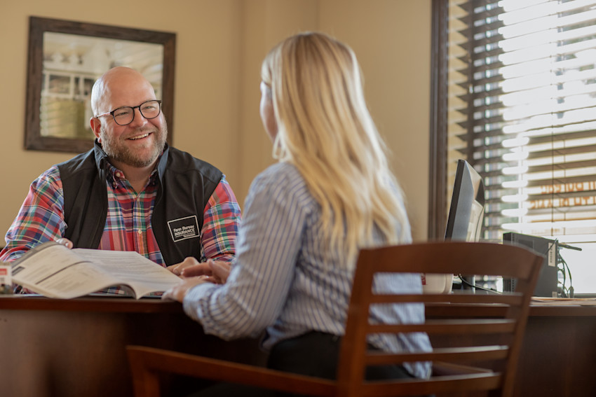 Farm Bureau Insurance of Tennessee agent meeting with woman who owns local business