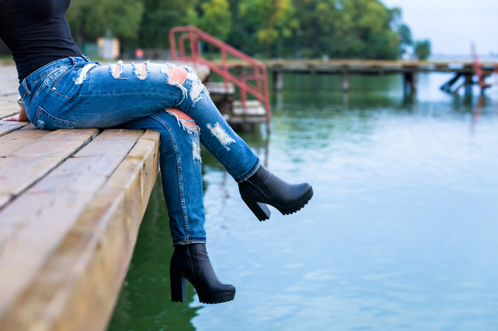 girl legs on pier
