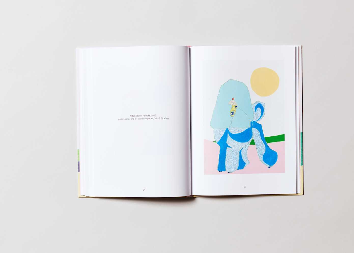 An open book with two lines of text on the left page and a painterly rendering of a colorful poodle on the right.