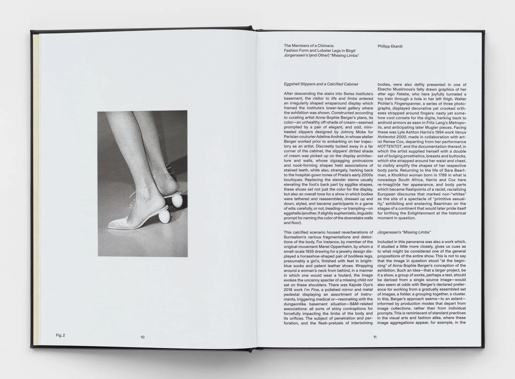 Open book with two columns of text on the right page. A black and white photograph of a woman's feet in heels is on the left page.