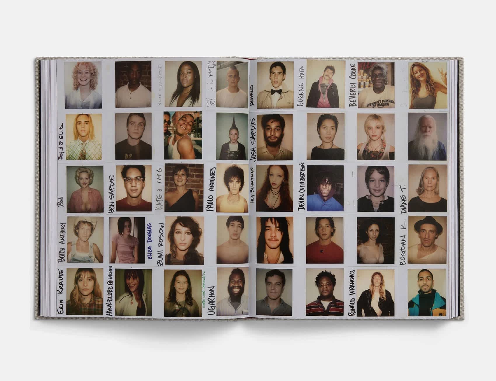 An open book in which the left and right pages are filled with polaroids of people. Everyone is different, some are smiling, others are serious. Names are written on the left side of some of the polaroids.