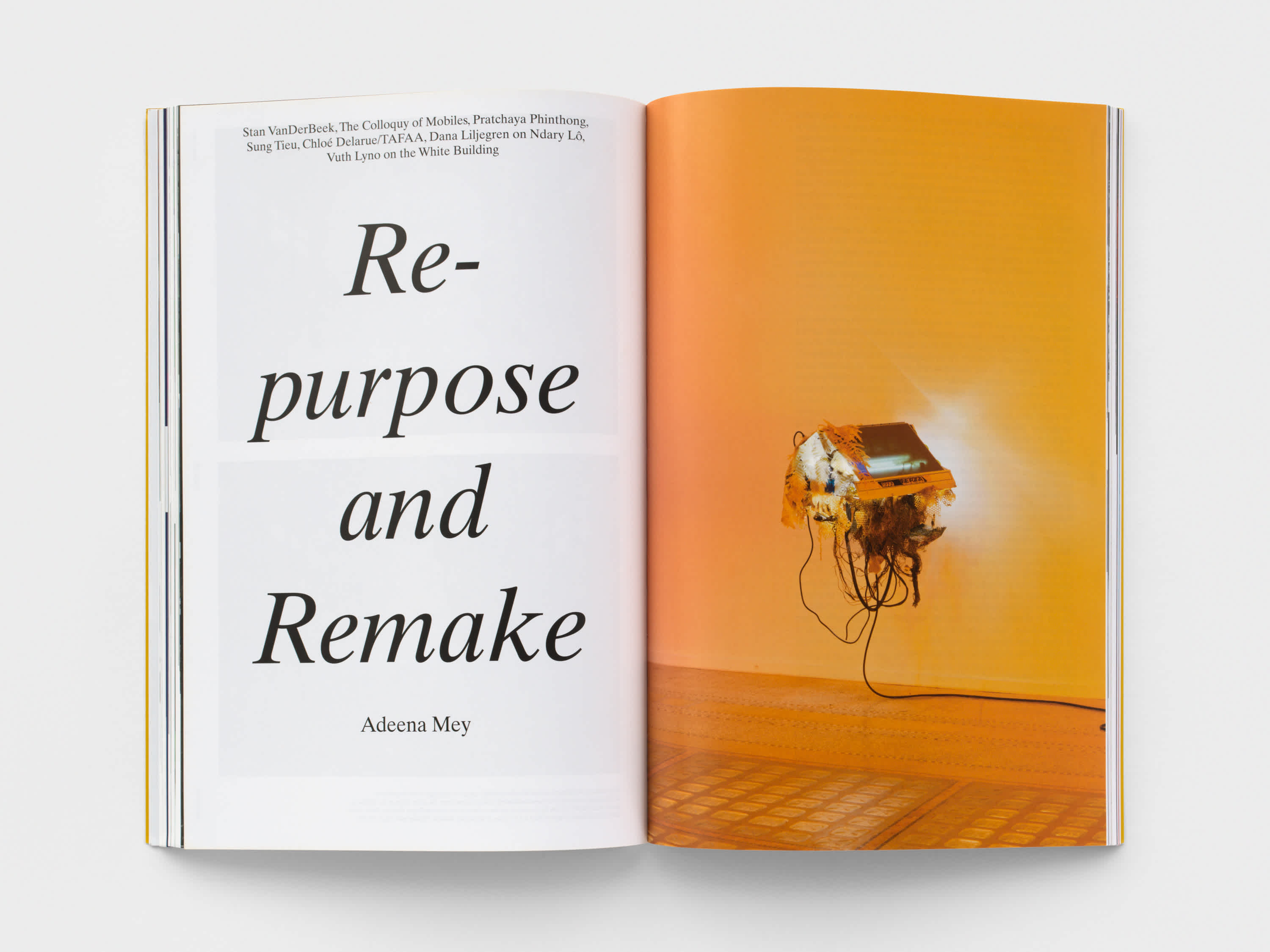 Magazine interior with a section title on the left page and a yellow-orange image on the right page.