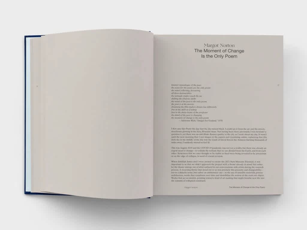 Open book with cream paper. Black text covers the right page.