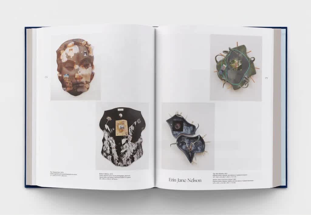 An open book with four photos of artworks in the page corners.