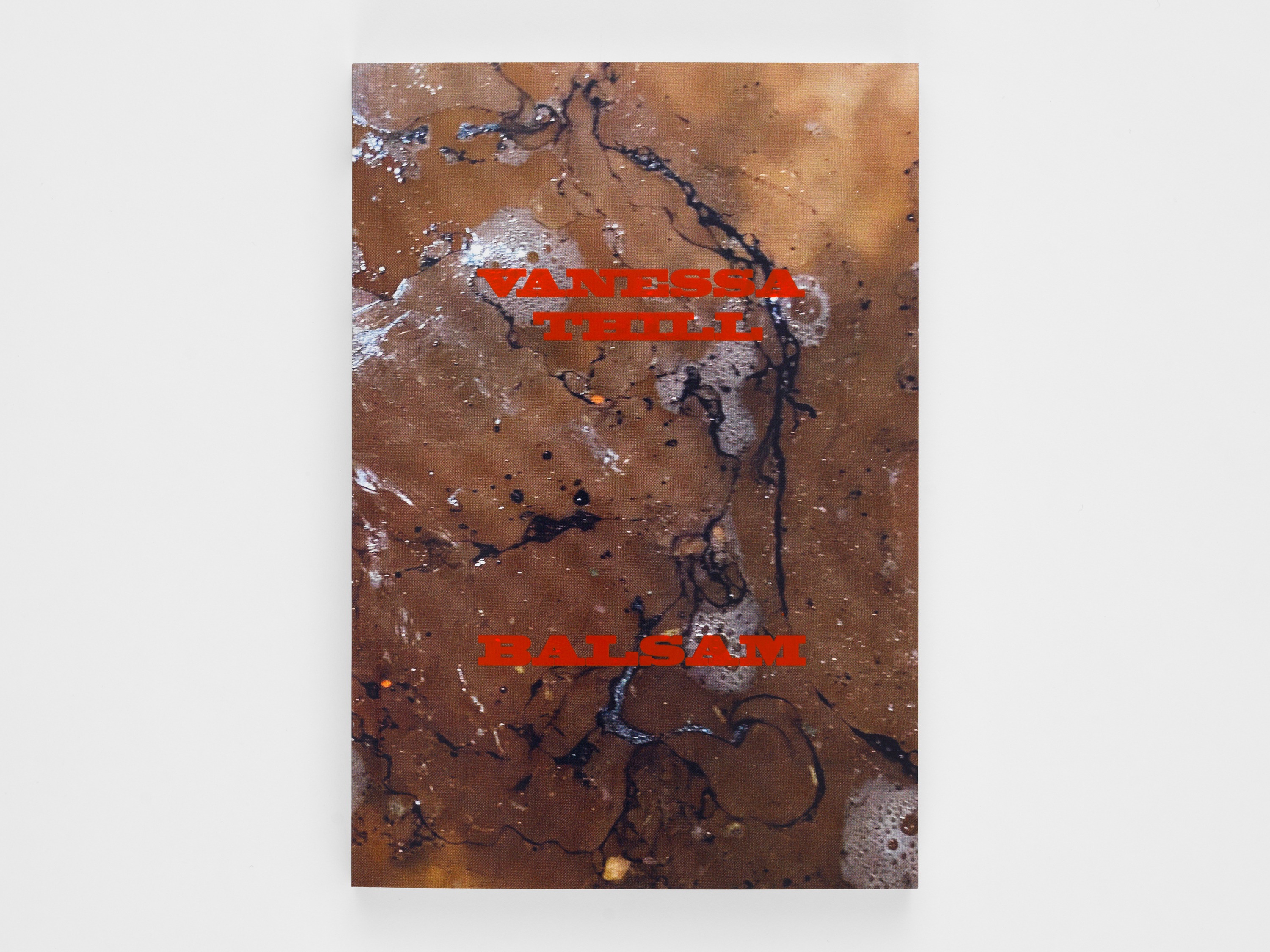 Book cover with red text on a beige and black bodily background.