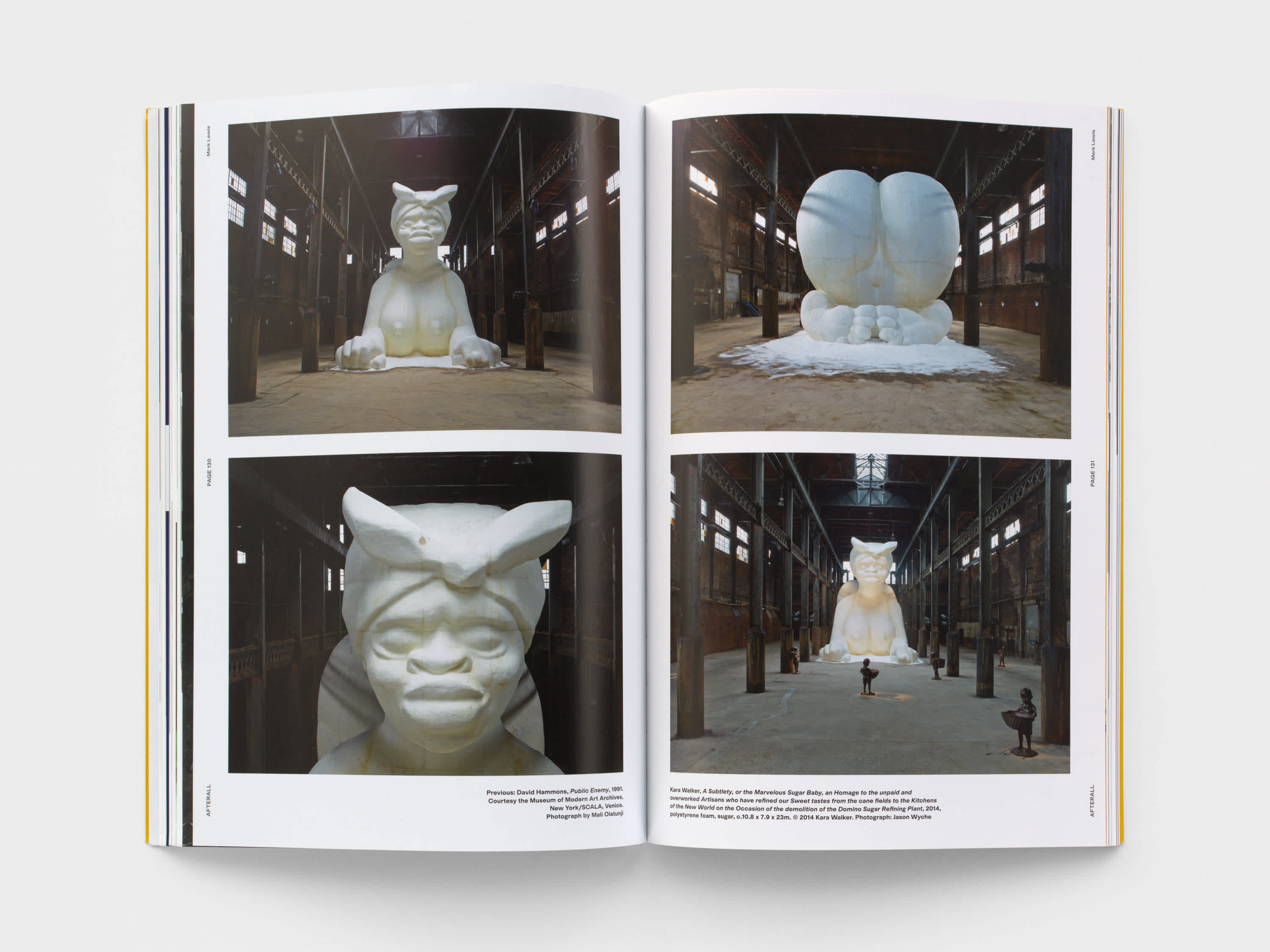 Open magazine with two images on the top and bottom of the left and right pages. The images are of a large-scale sculpture of a woman in a Sphinx position. The sculpture is white and fills the room  in which it's placed.