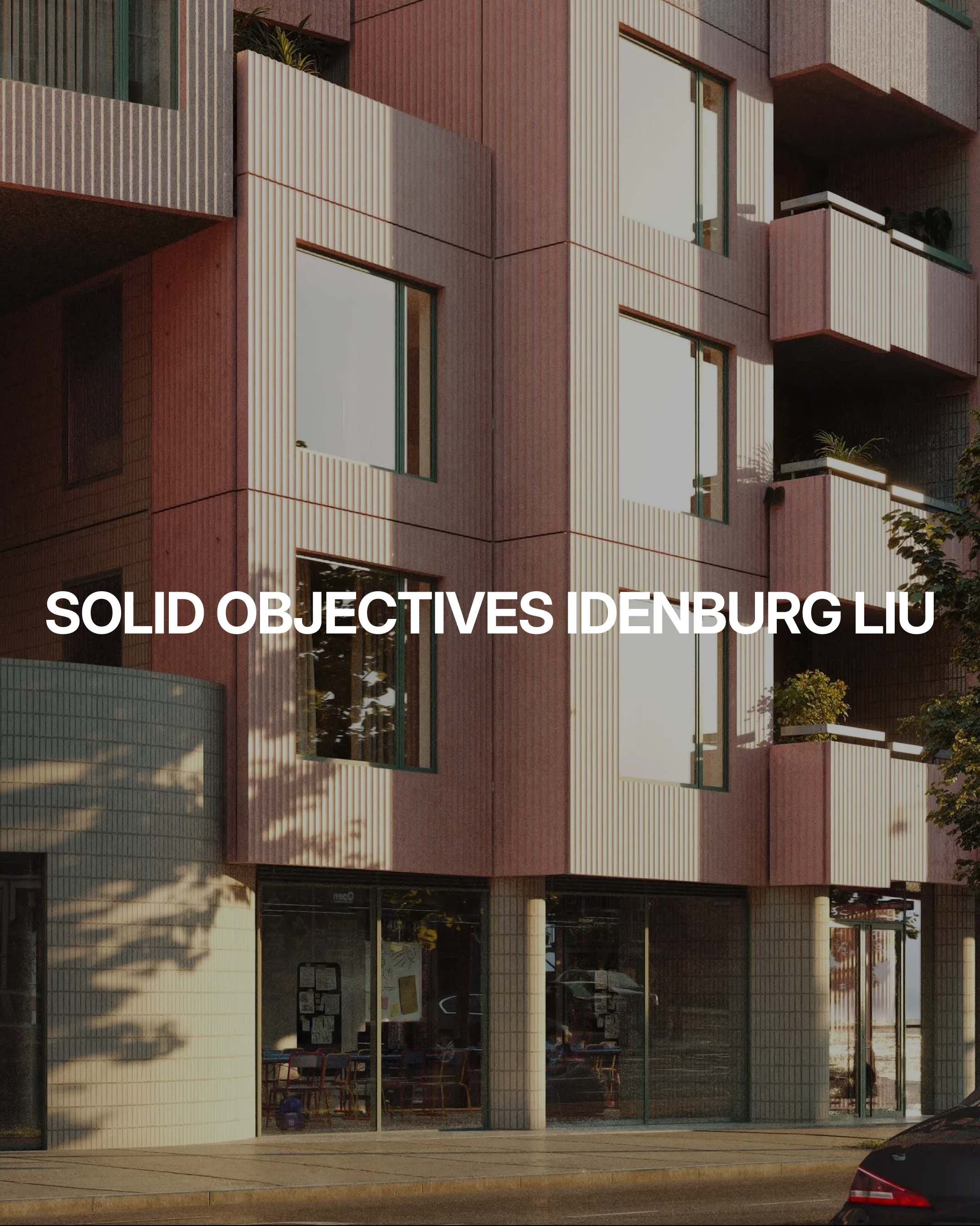 A modern building with pink textured exterior panels and large windows, some with balconies and plants; white text in the center reads SOLID OBJECTIVES IDENBURG LIU.