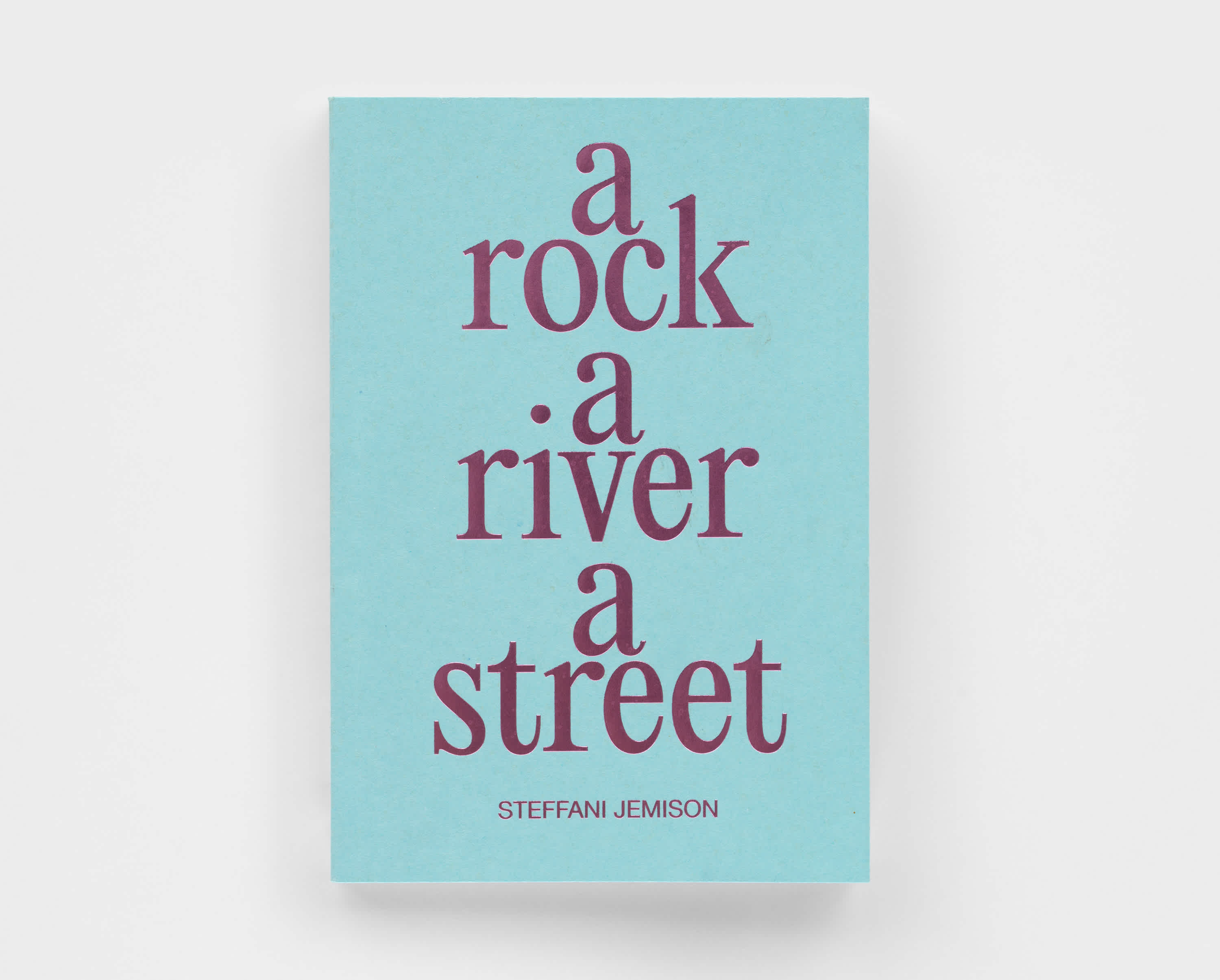 Light blue book cover, with a metallic purple title that reads "a rock, a river, a street" in lowercase. Each word is stacked on top of the other. The author's name, Steffani Jemison, sits below the title in all capital letters.