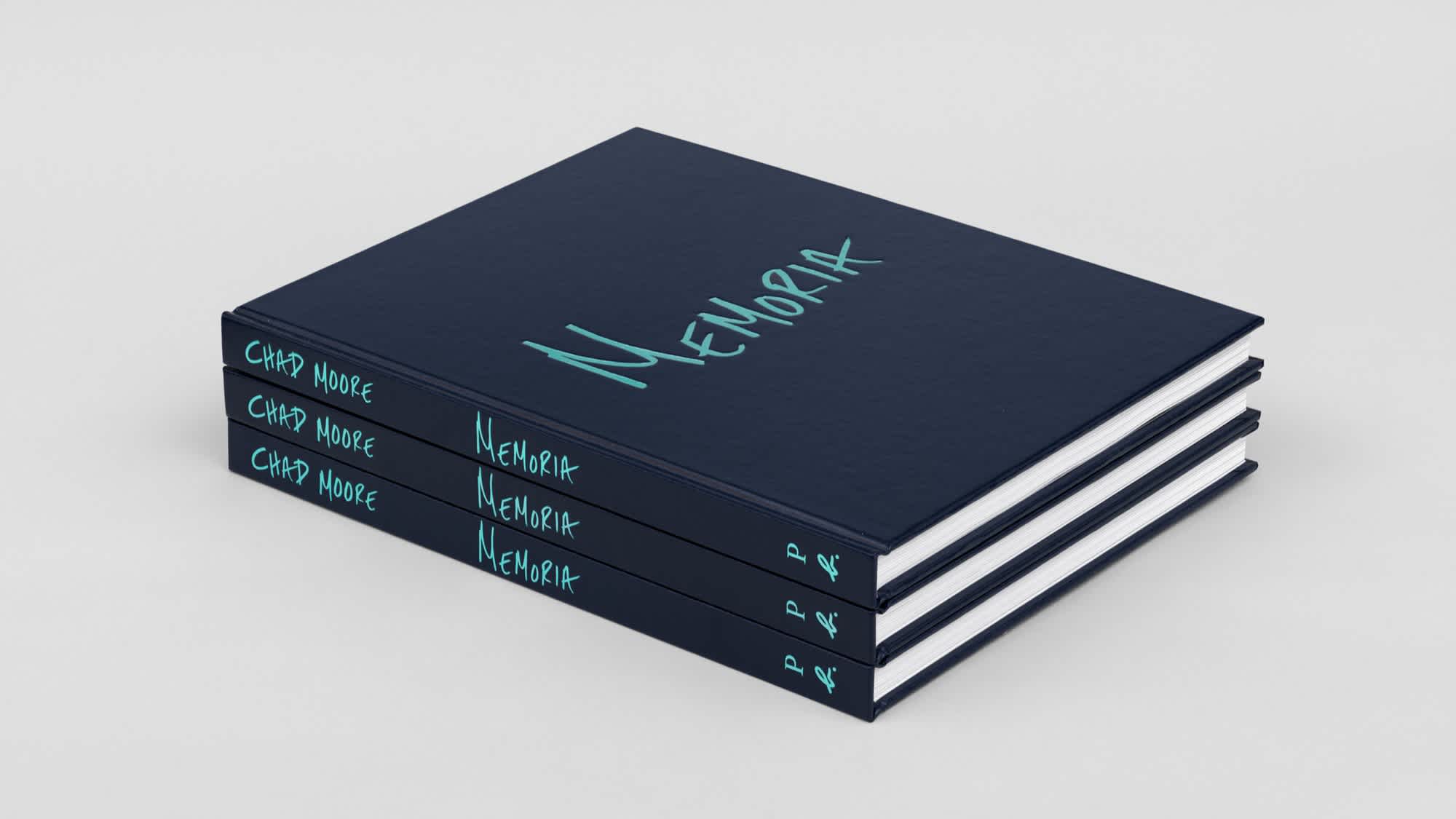 Three navy blue books with light blue text on the cover and spine, aligned on top of each other.