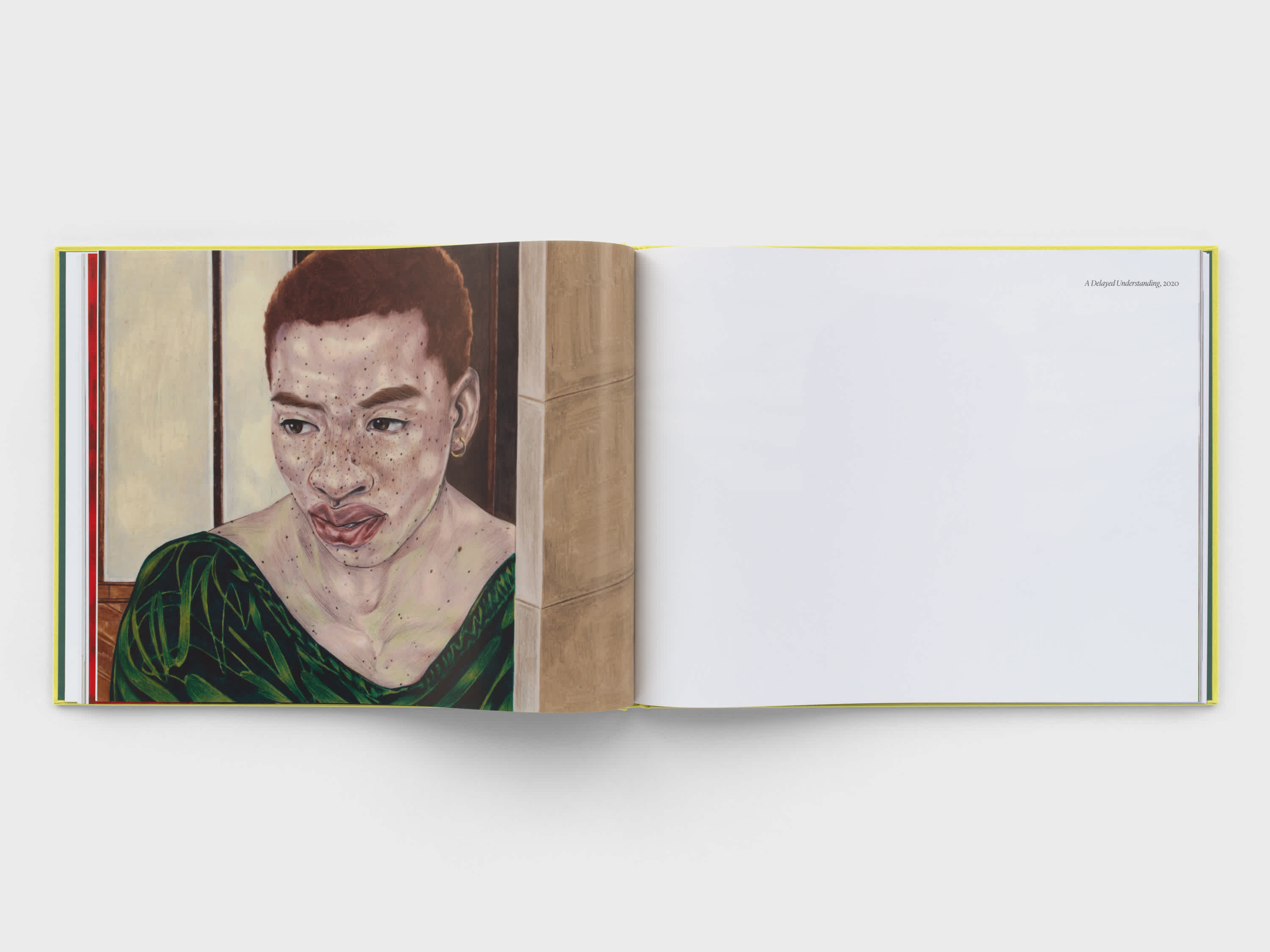 Two pages of an open book. The right page is blank. The left page has a drawing of a woman's face. She wears a dark green shirt and seems to be standing in a doorway.