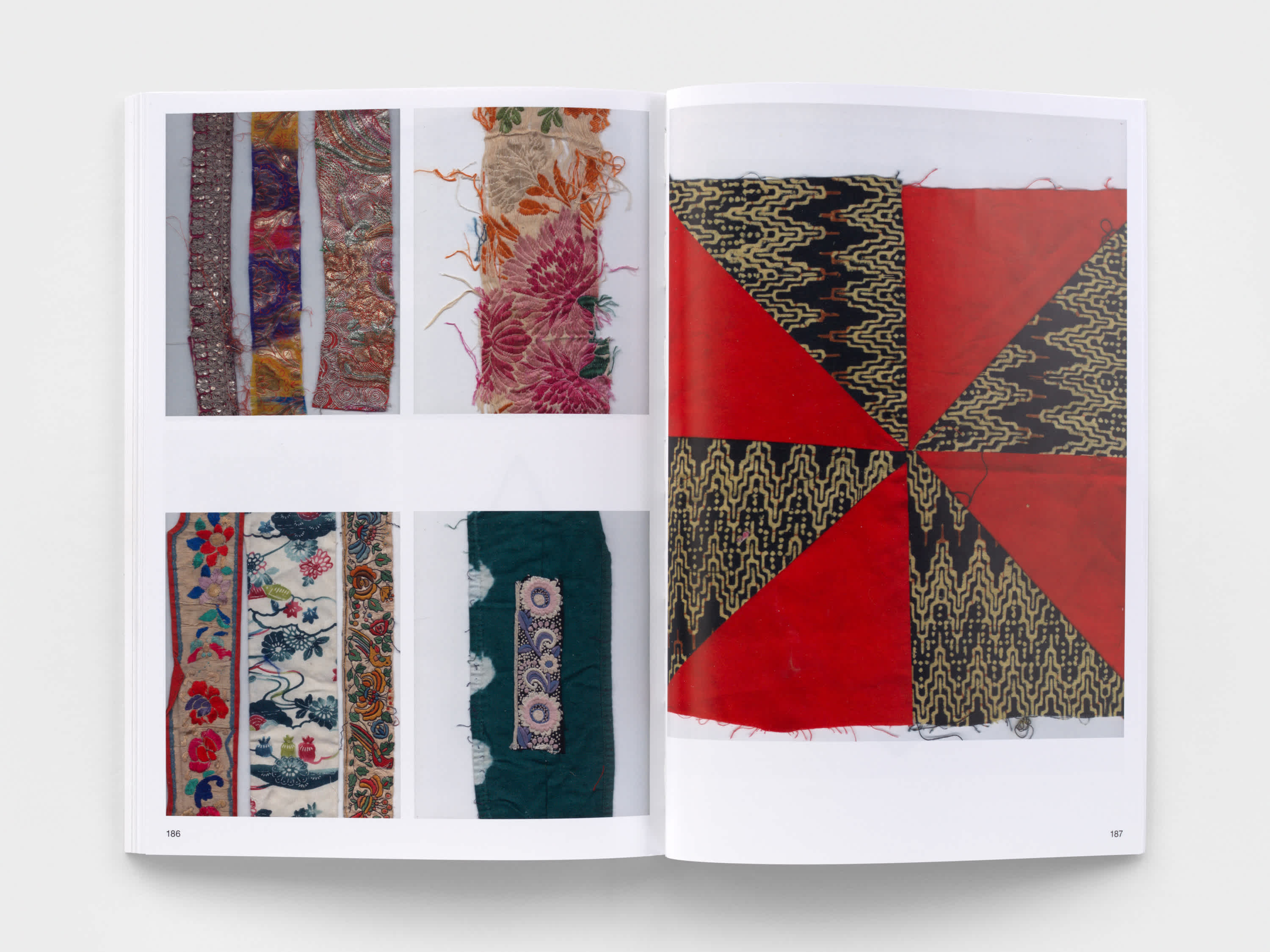Open book with textile samples on both pages.
