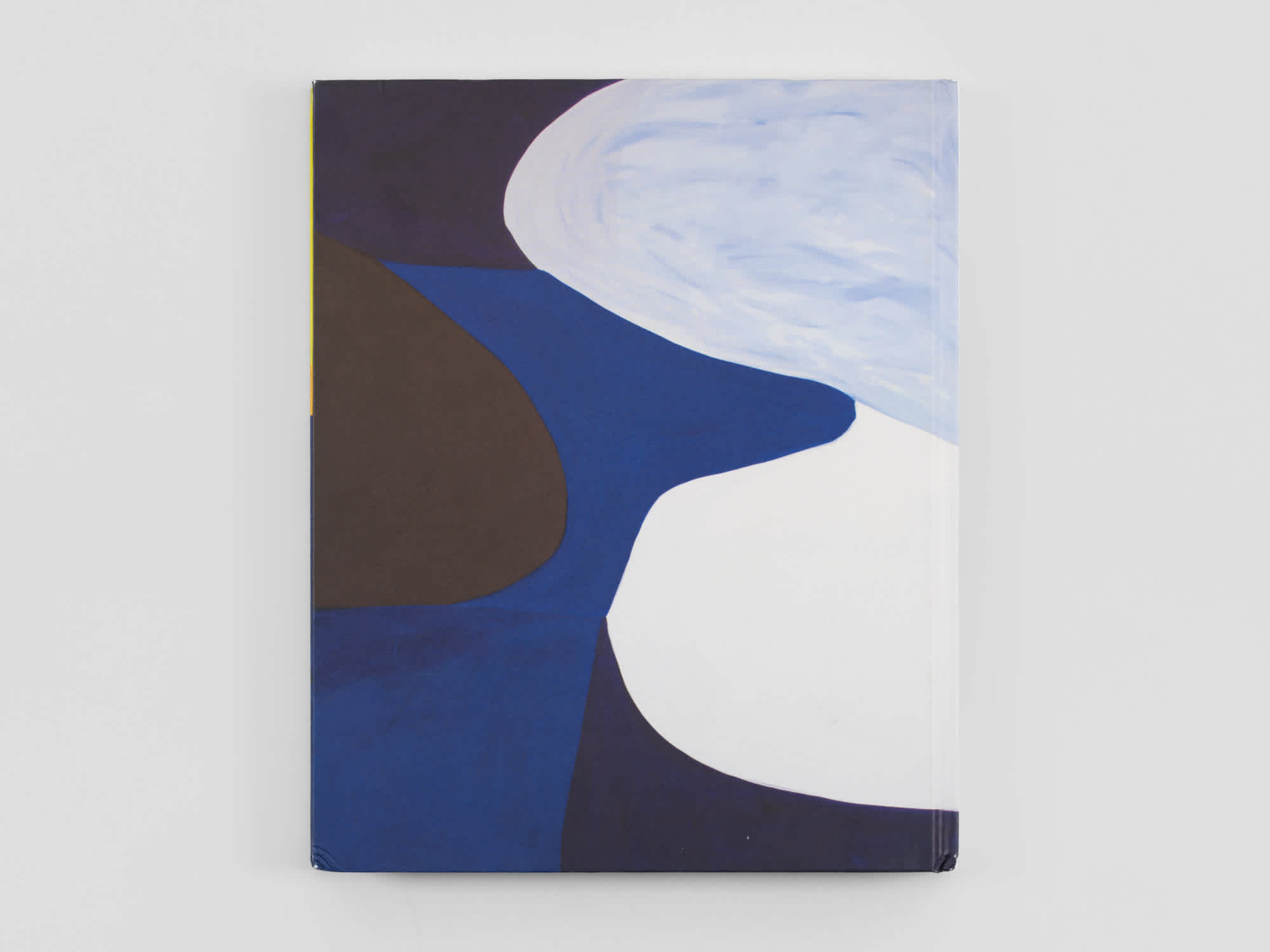 Back cover of a book painted with varying hues of blue rounded shapes.