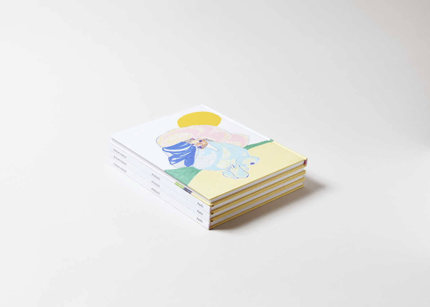 Stack of four identical books. A colorful yellow, pink and blue painterly poodle is on the back cover of the top book.