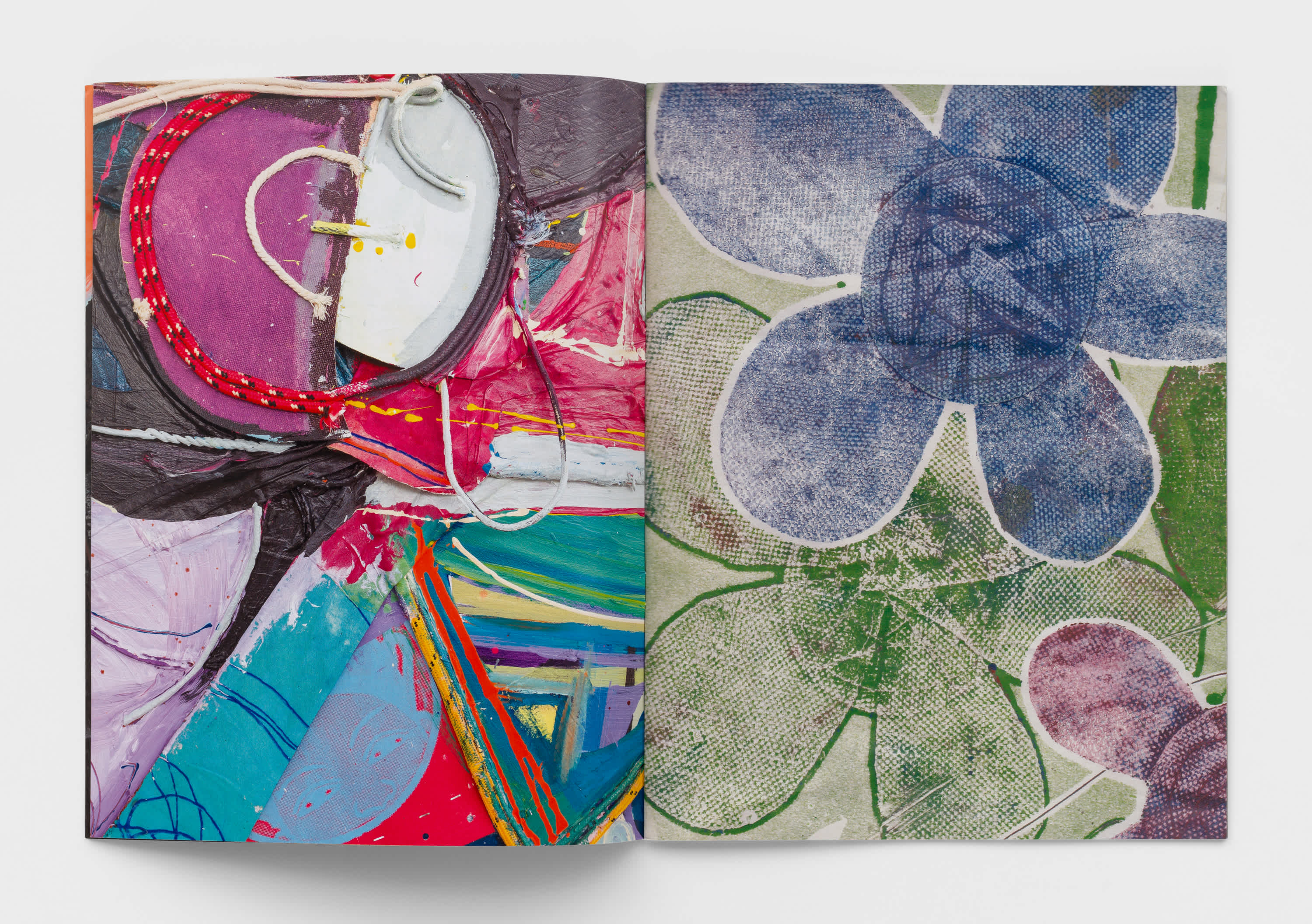 Open book with colorful abstract artworks on both pages.