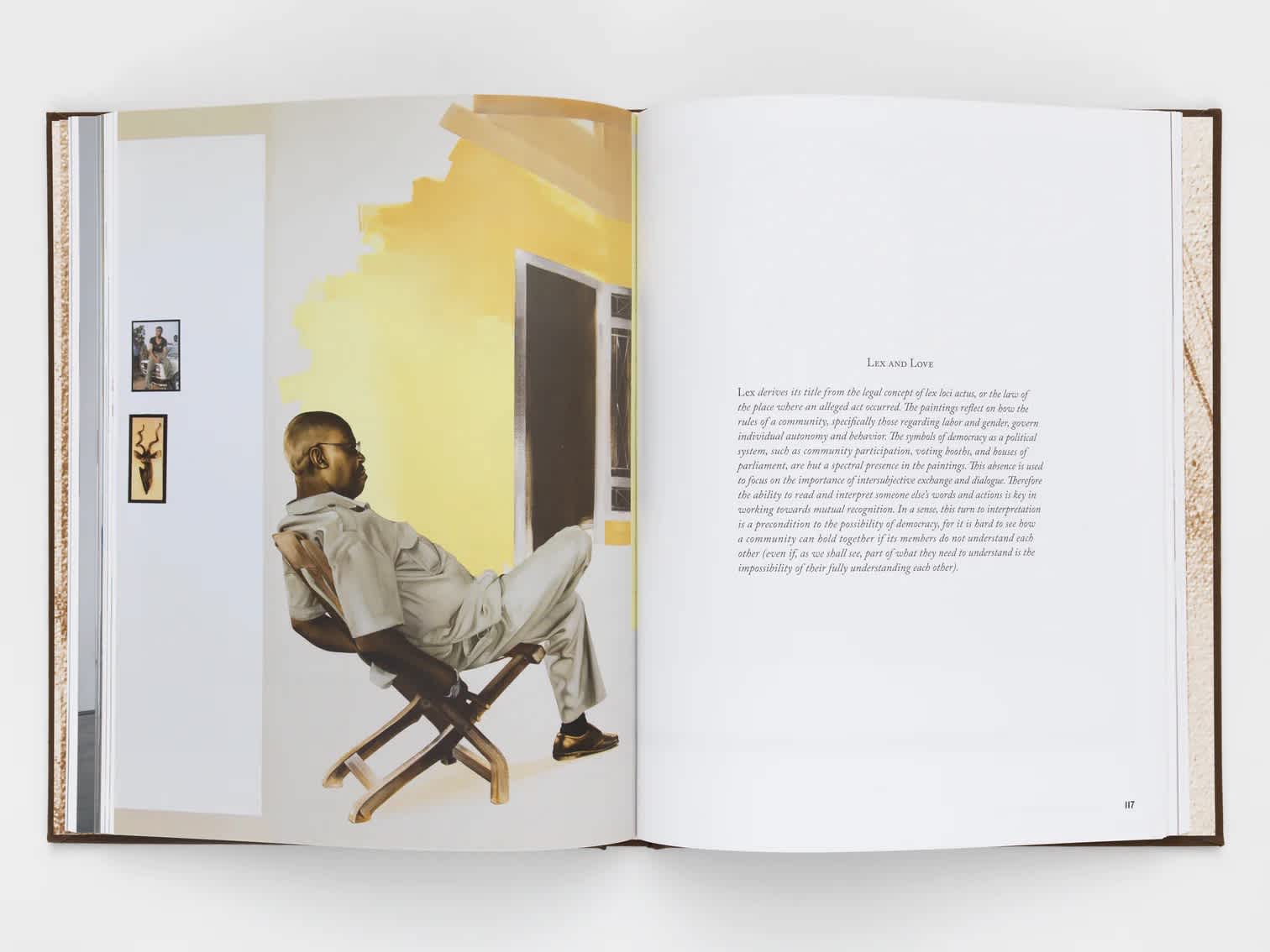 Open book with a painting on the left page and text on the right.