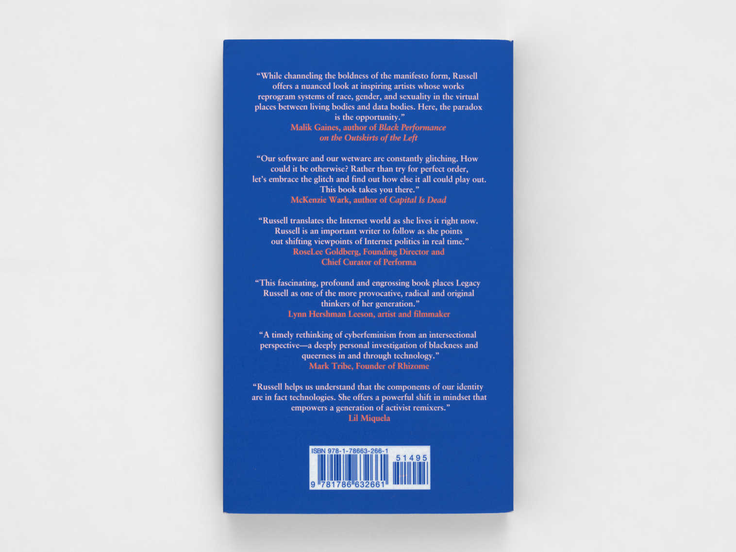 Tall dark blue book with white and peach text along the back cover.