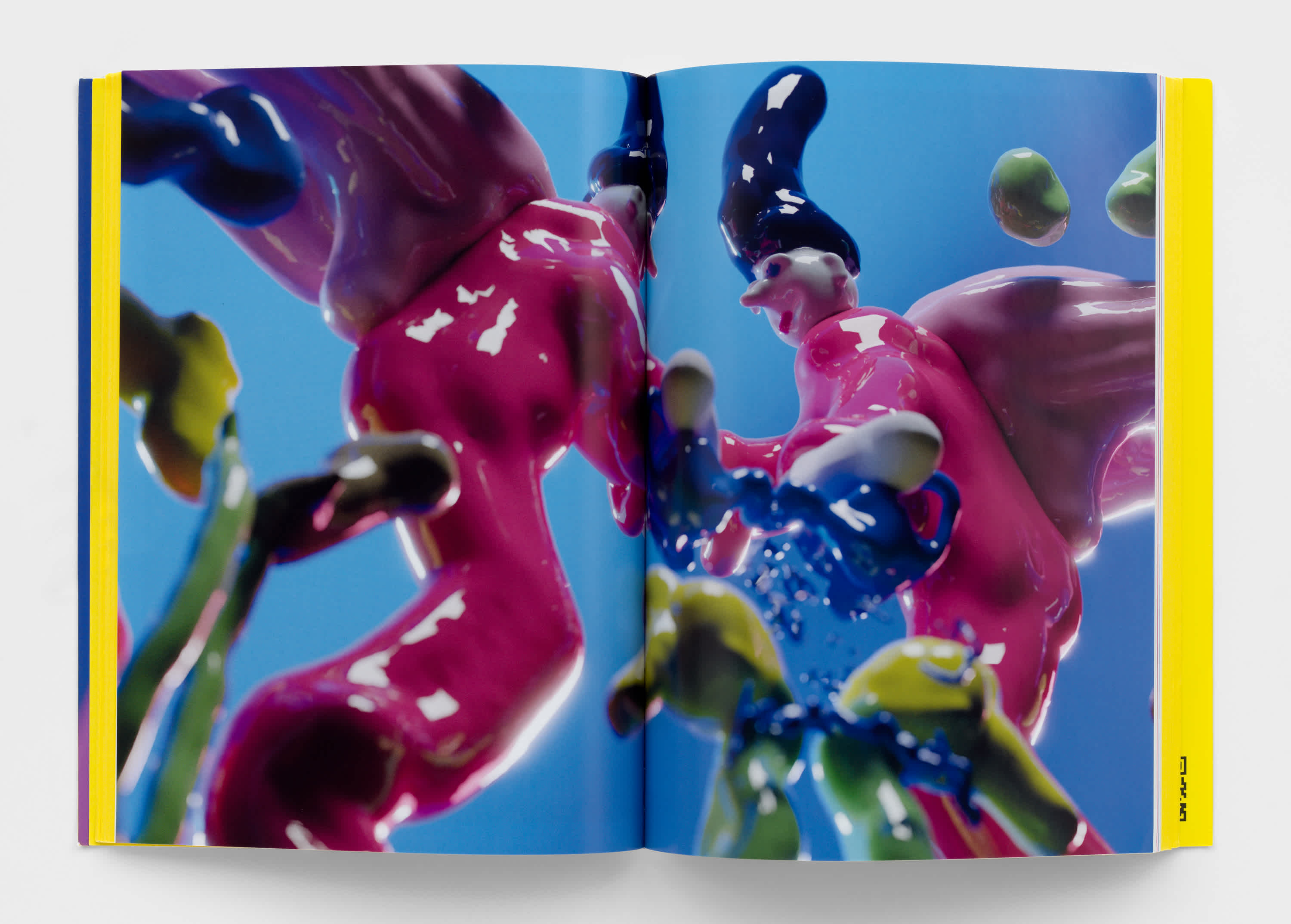 Open book with full bleed, centerfold image of the artist Austin Lee's sculptures.