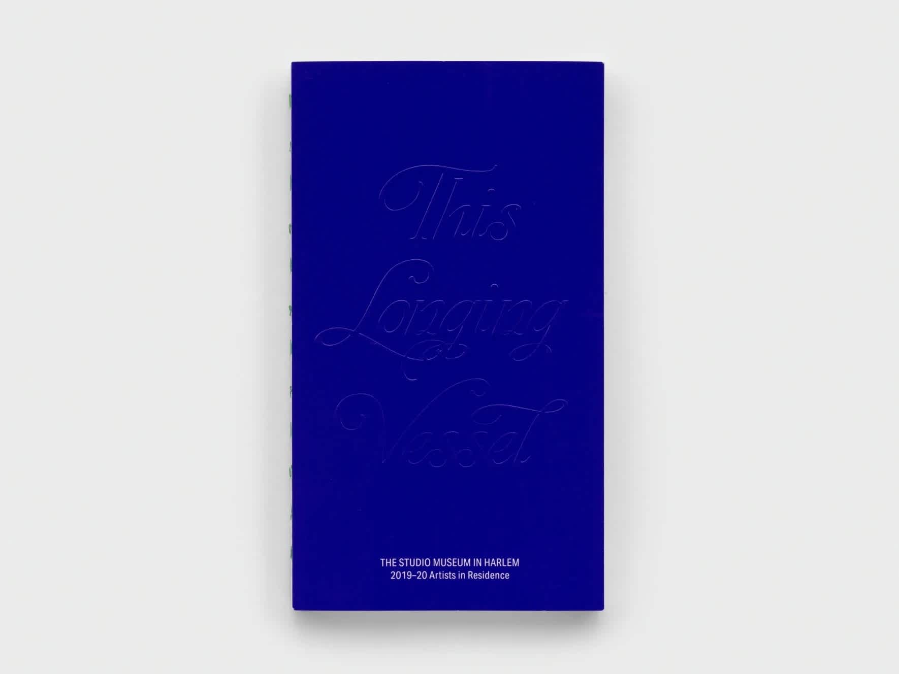 Royal blue book with embossed title.
