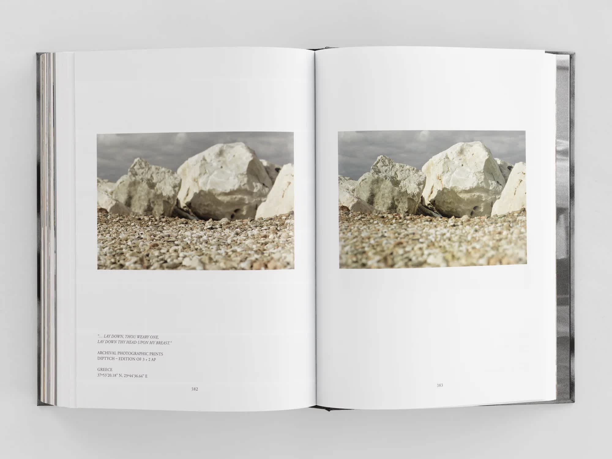 Open book with the same photo of a rock on both pages.
