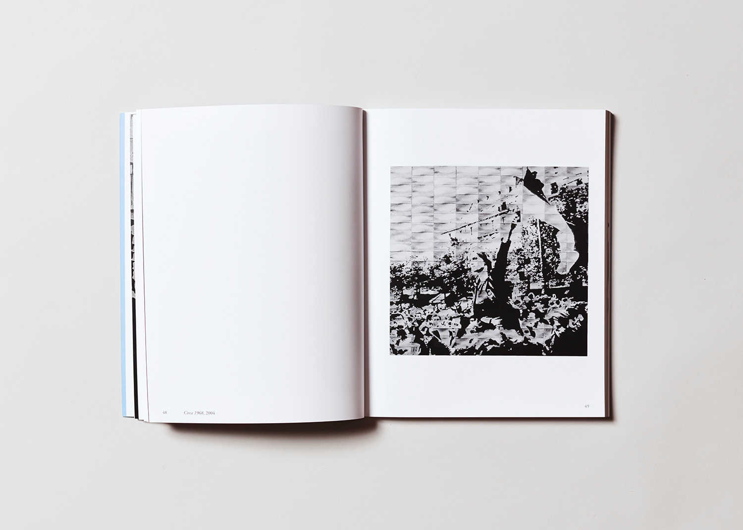 Book interior. The left page is blank, the right page has a black and white artwork by the artist Mary Kelly.