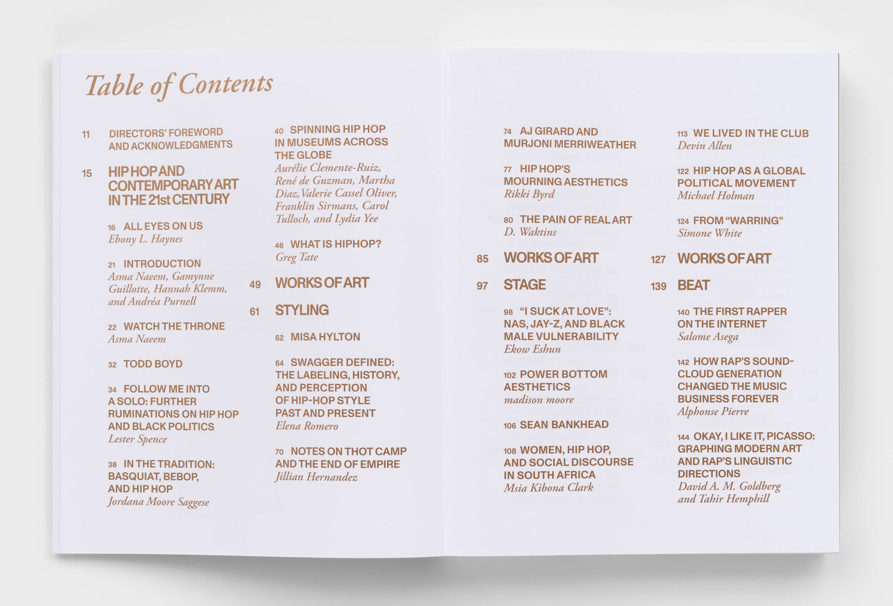 Open book with white pages and copper text.