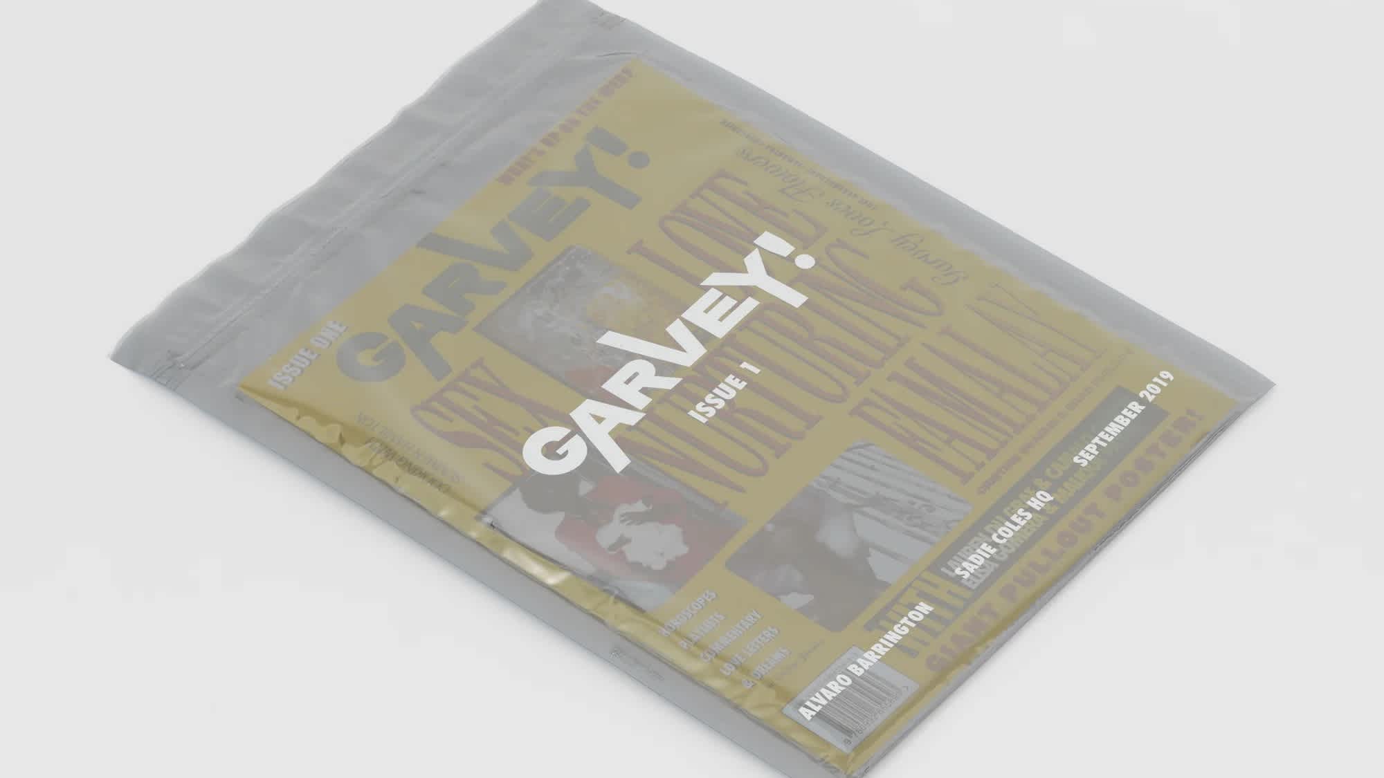 Bright yellow book inside of a grey plastic film with white text.
