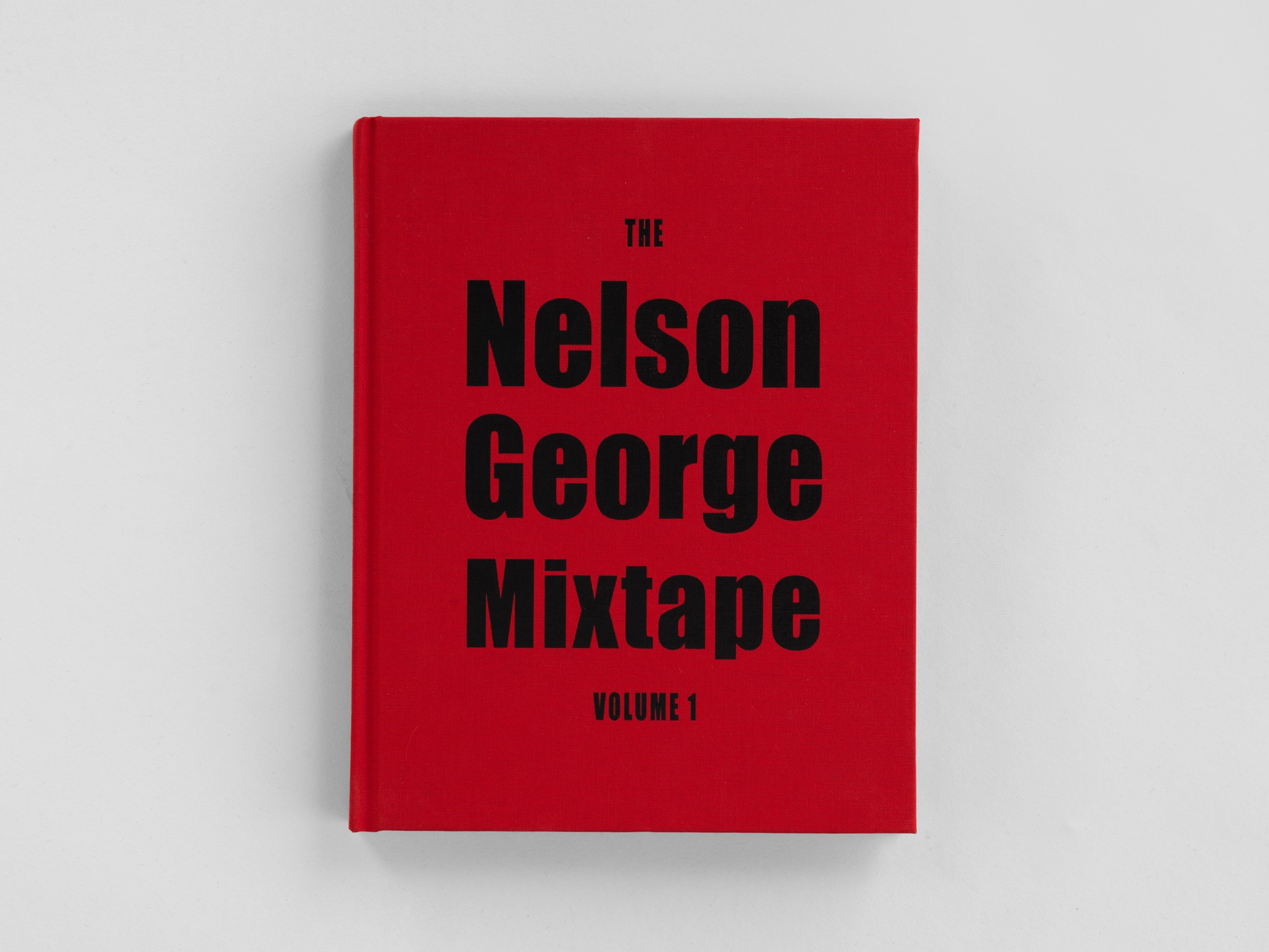 Bright red book with bold, black title, "The Nelson George Mixtape, Vol. 1" on the front cover. The book faces head on.