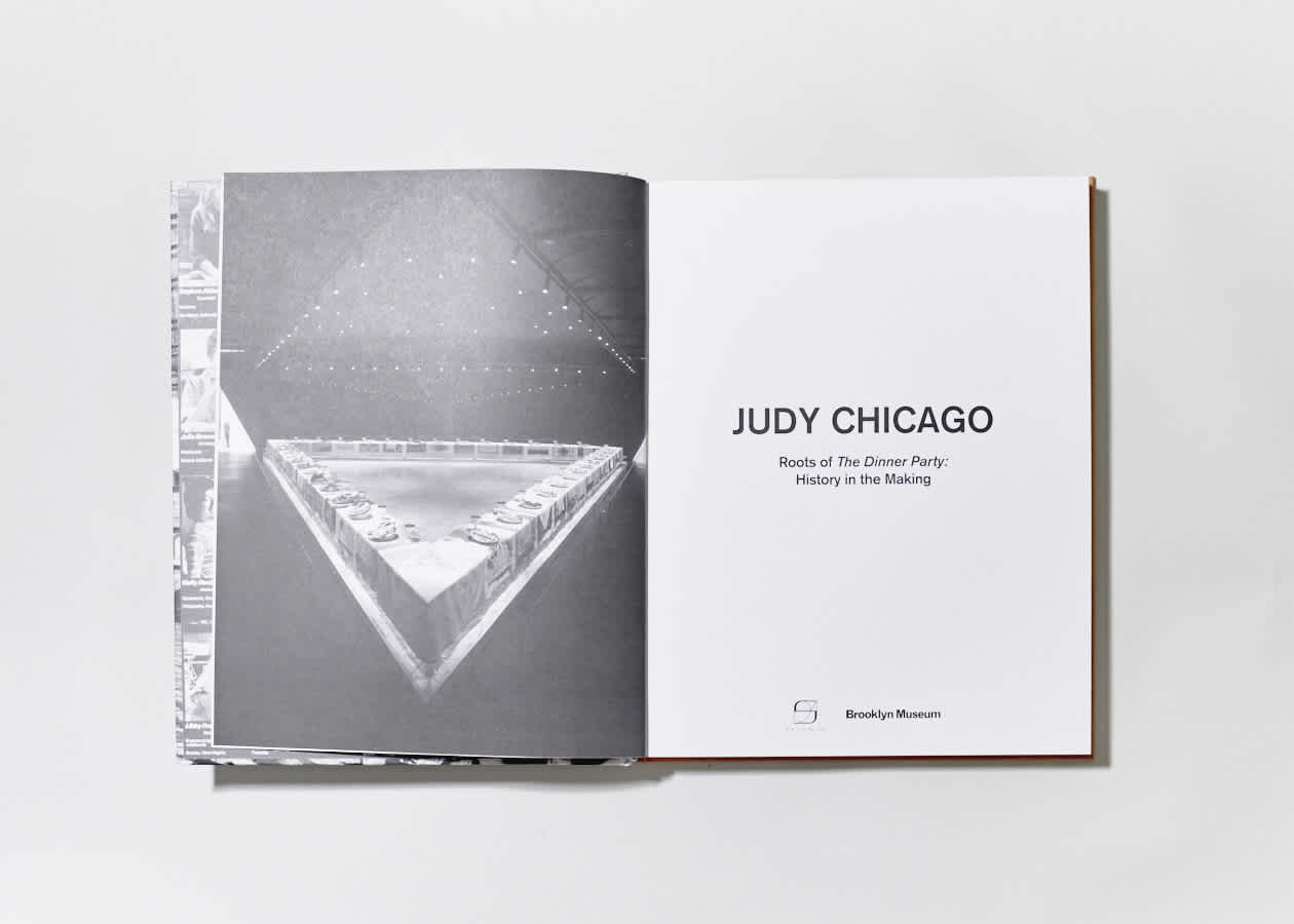 Open book with black and white photo on the left page and title page on the right.