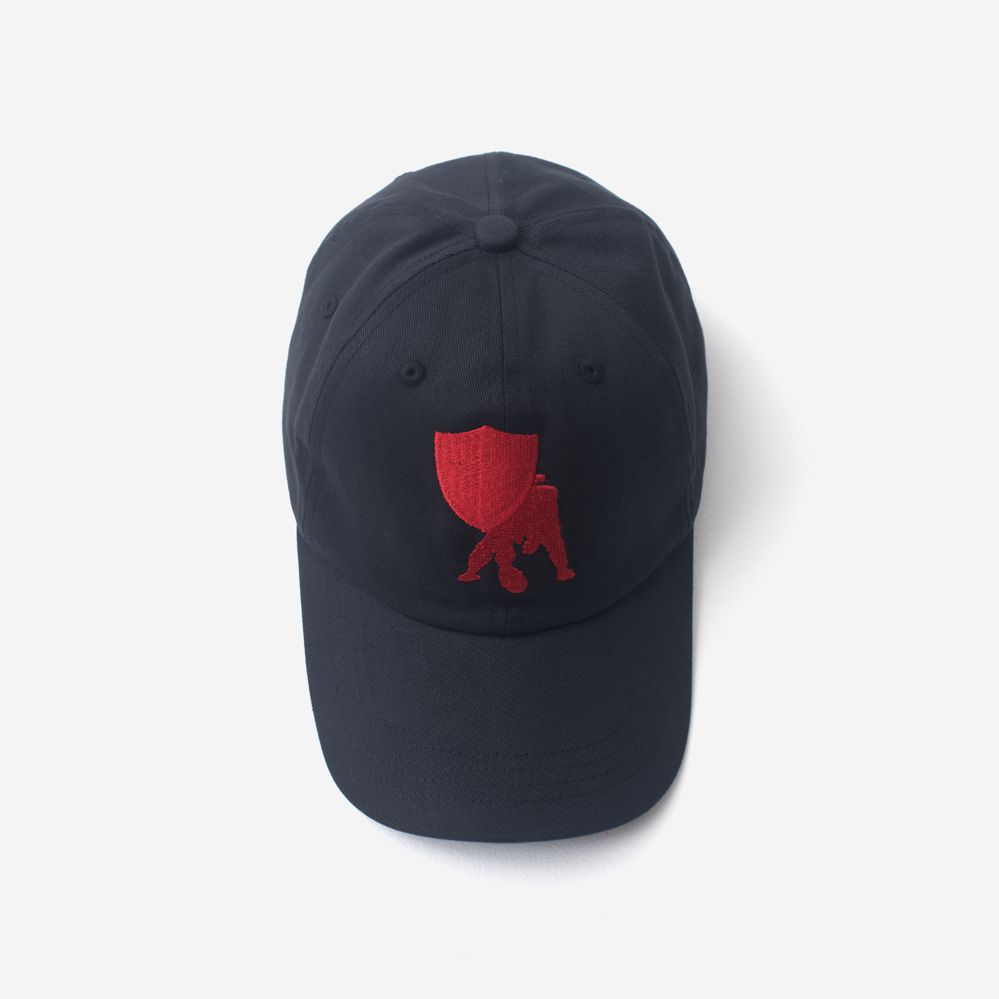Image of a navy blue hat on a grey background 