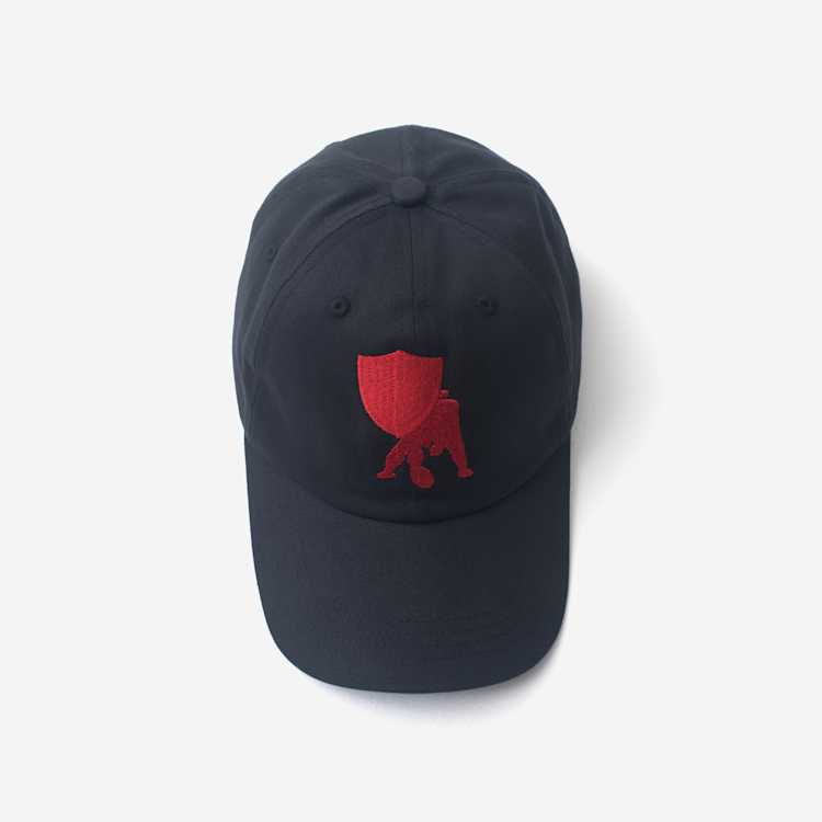 Image of a navy blue hat on a grey background