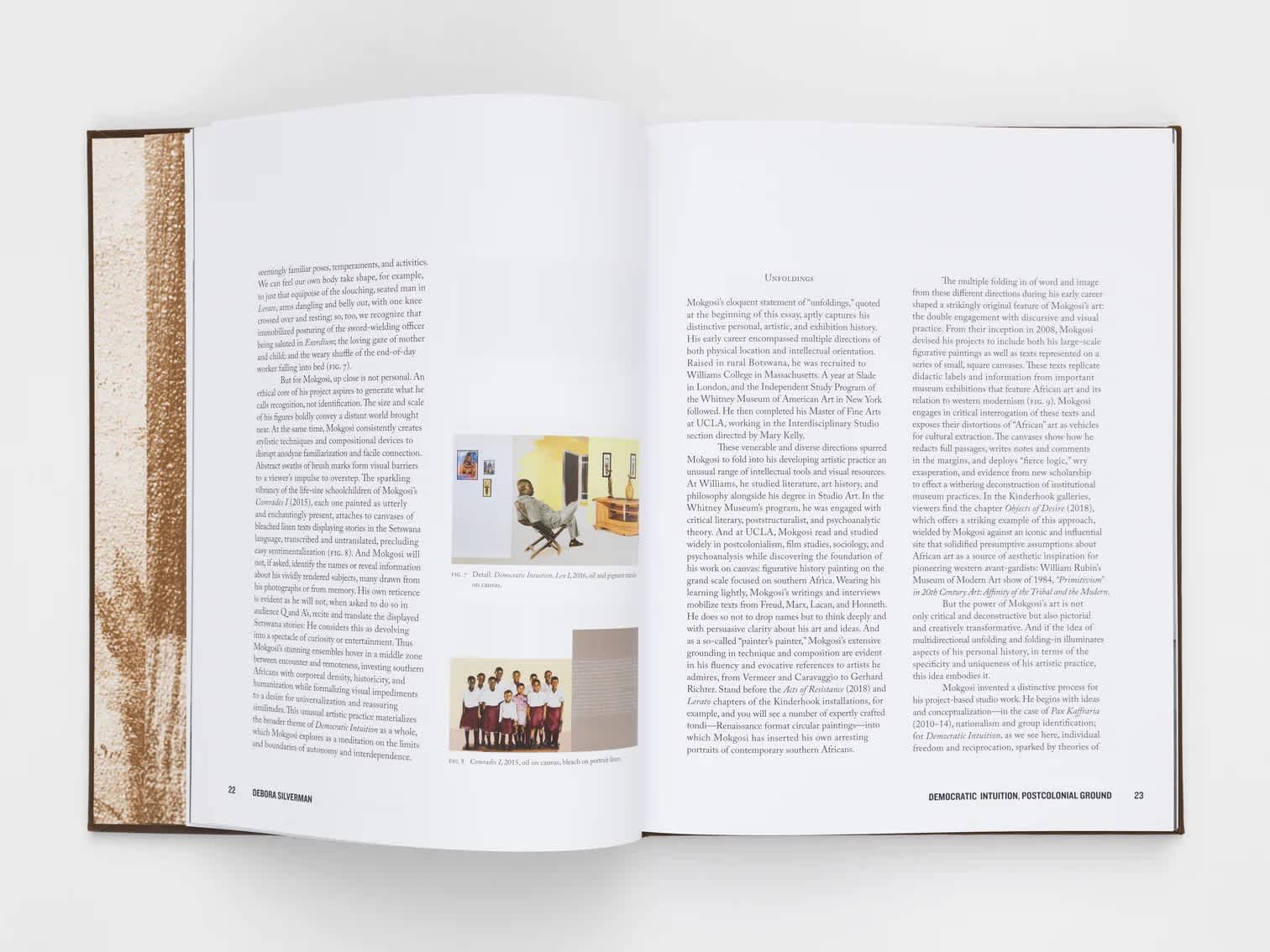 Open book with text and images on the left page and two columns of text on the right page.