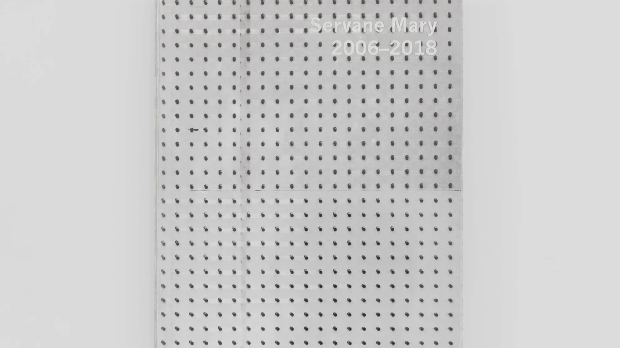 Silver book cover with black dot grid pattern.