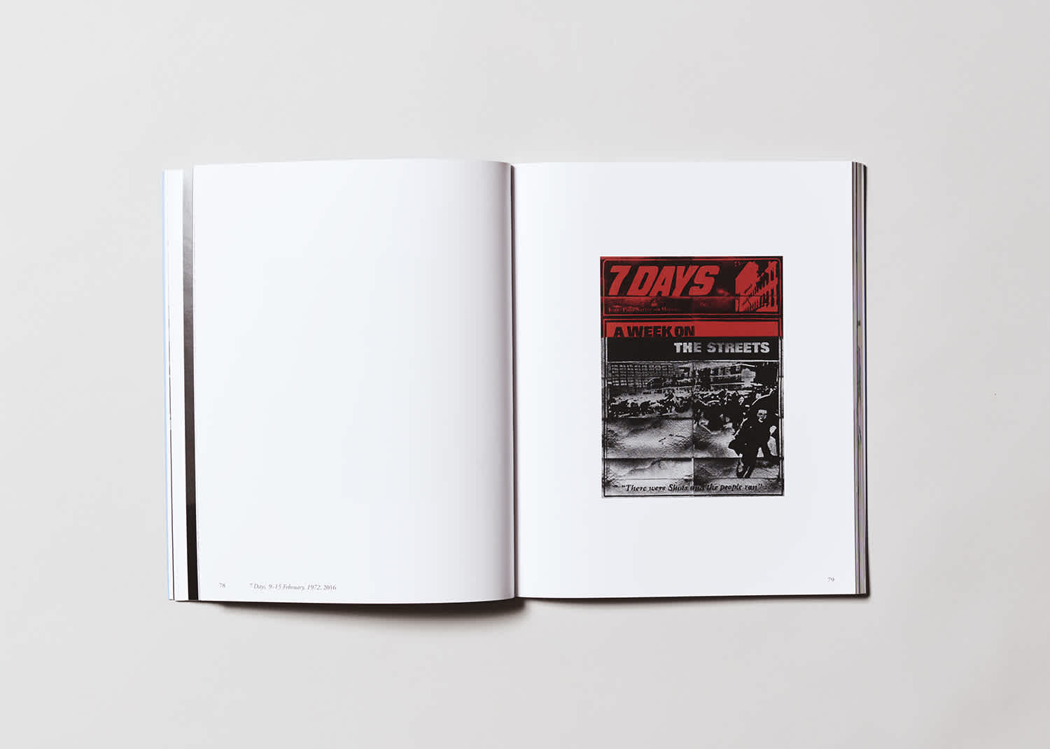 Book interior. The left page is blank, the right page has a black and red artwork by the artist Mary Kelly.
