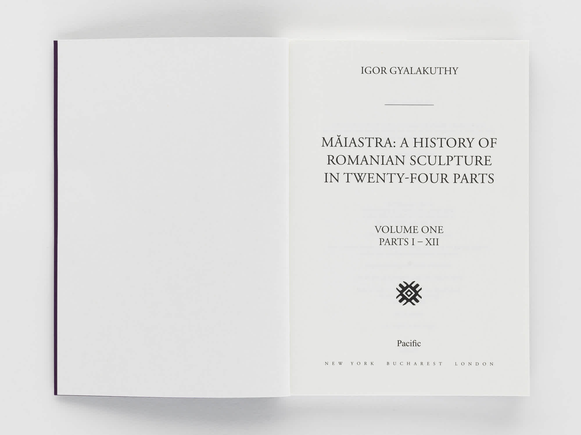 A book open to the title page. The left page is blank.
