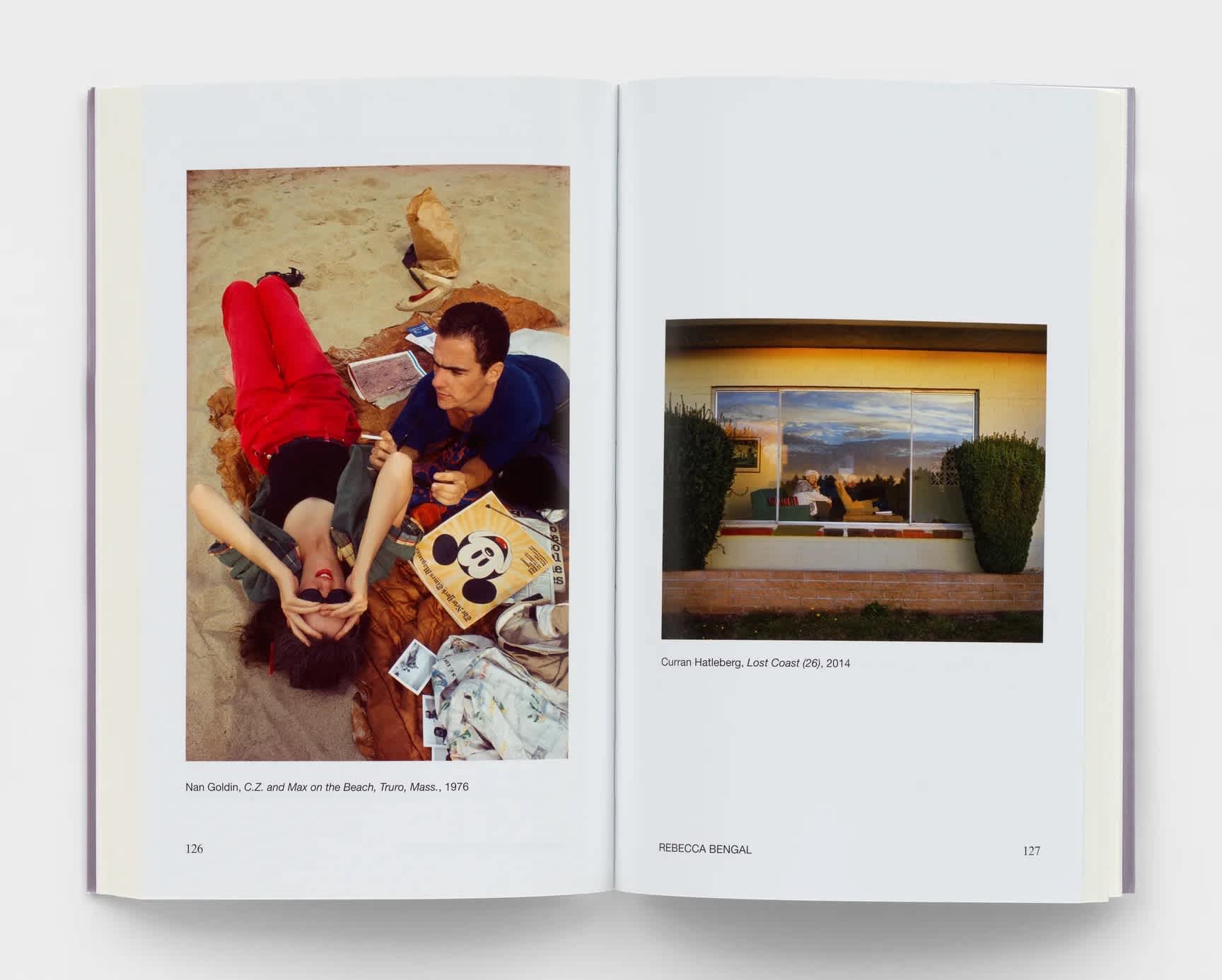 Open book with a photograph on either page.