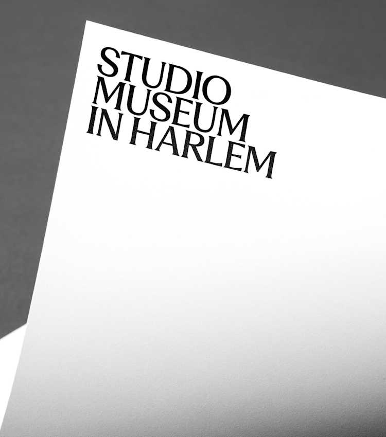 Curling white letter paper with bold black text in the top right corner.