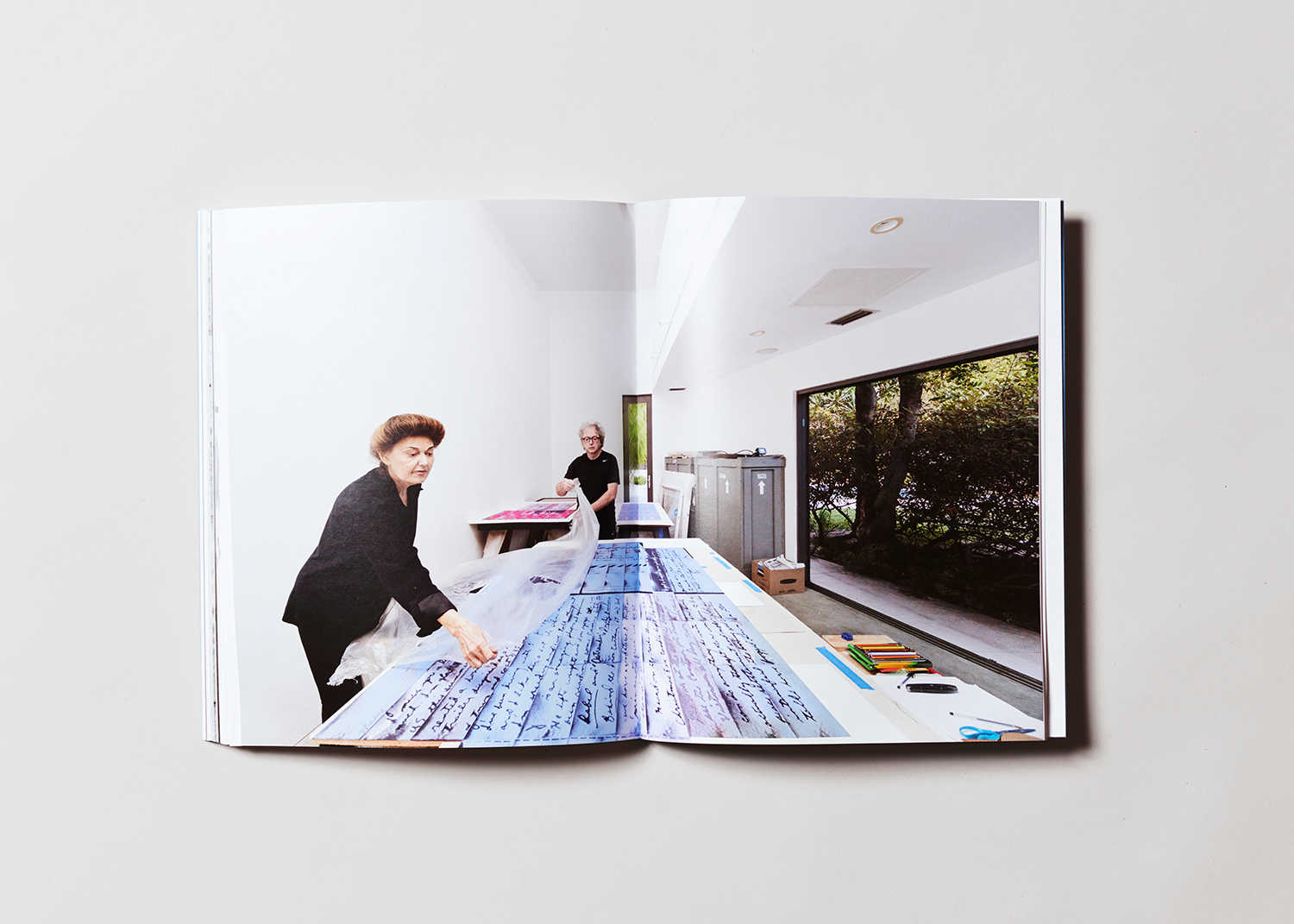 Centerfold depicting the artist Mary Kelly working.