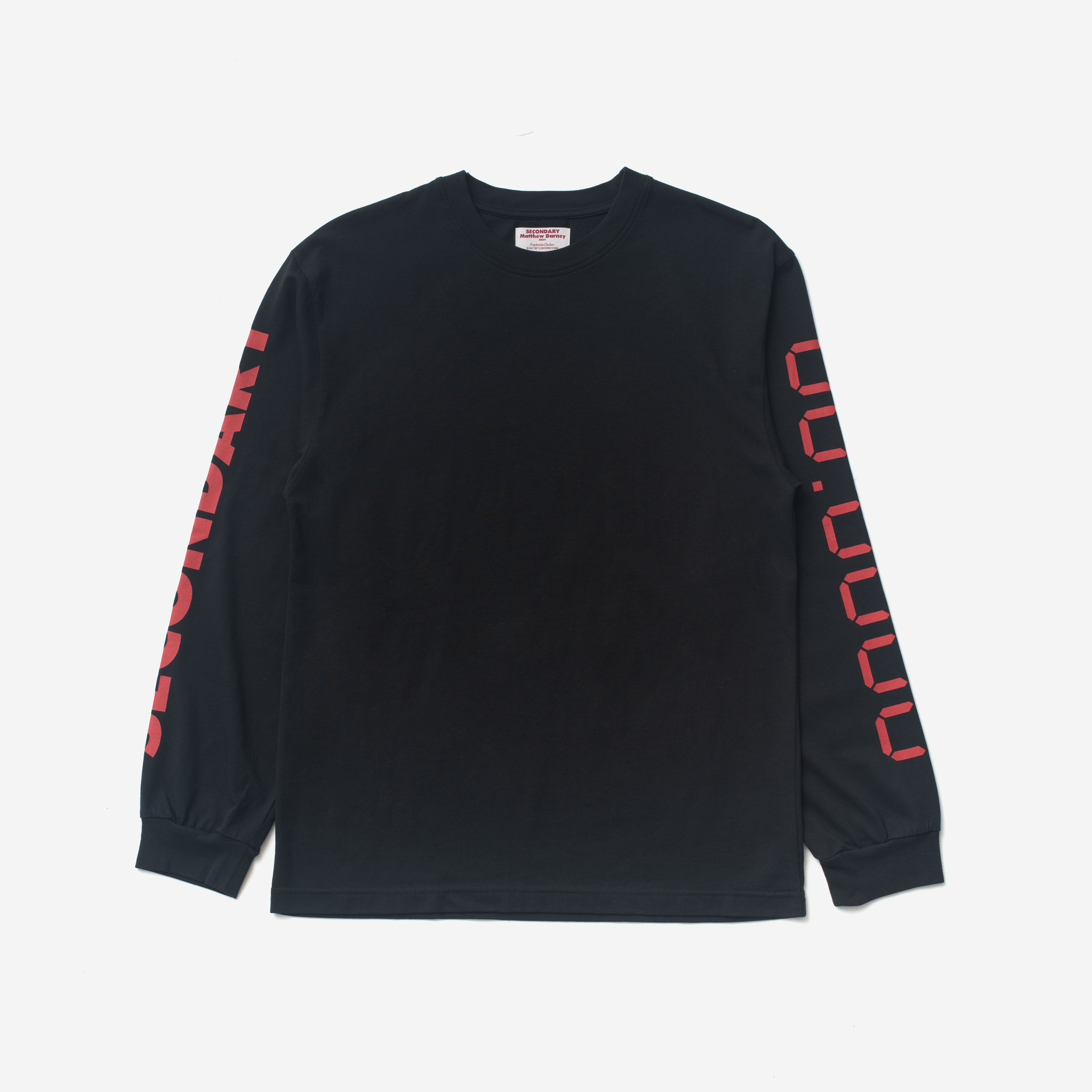 Image of a black long sleeve t-shirt on a grey background. 