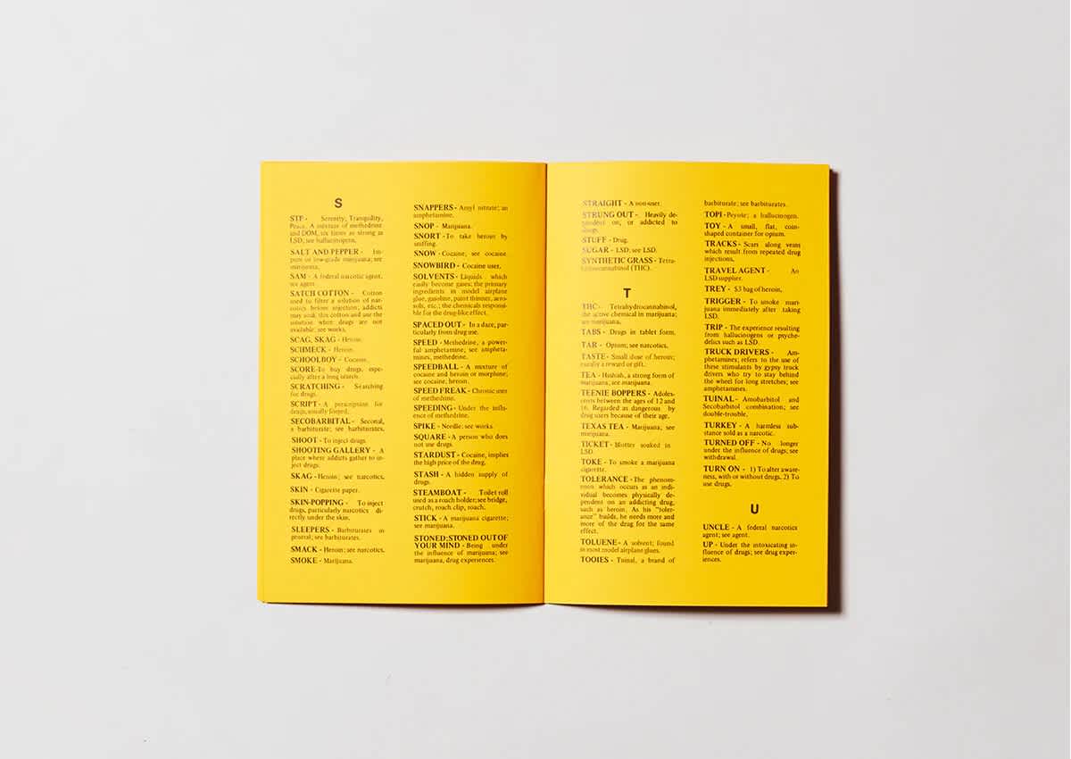 Bright yellow book that's open. Both pages have two columns of black text.
