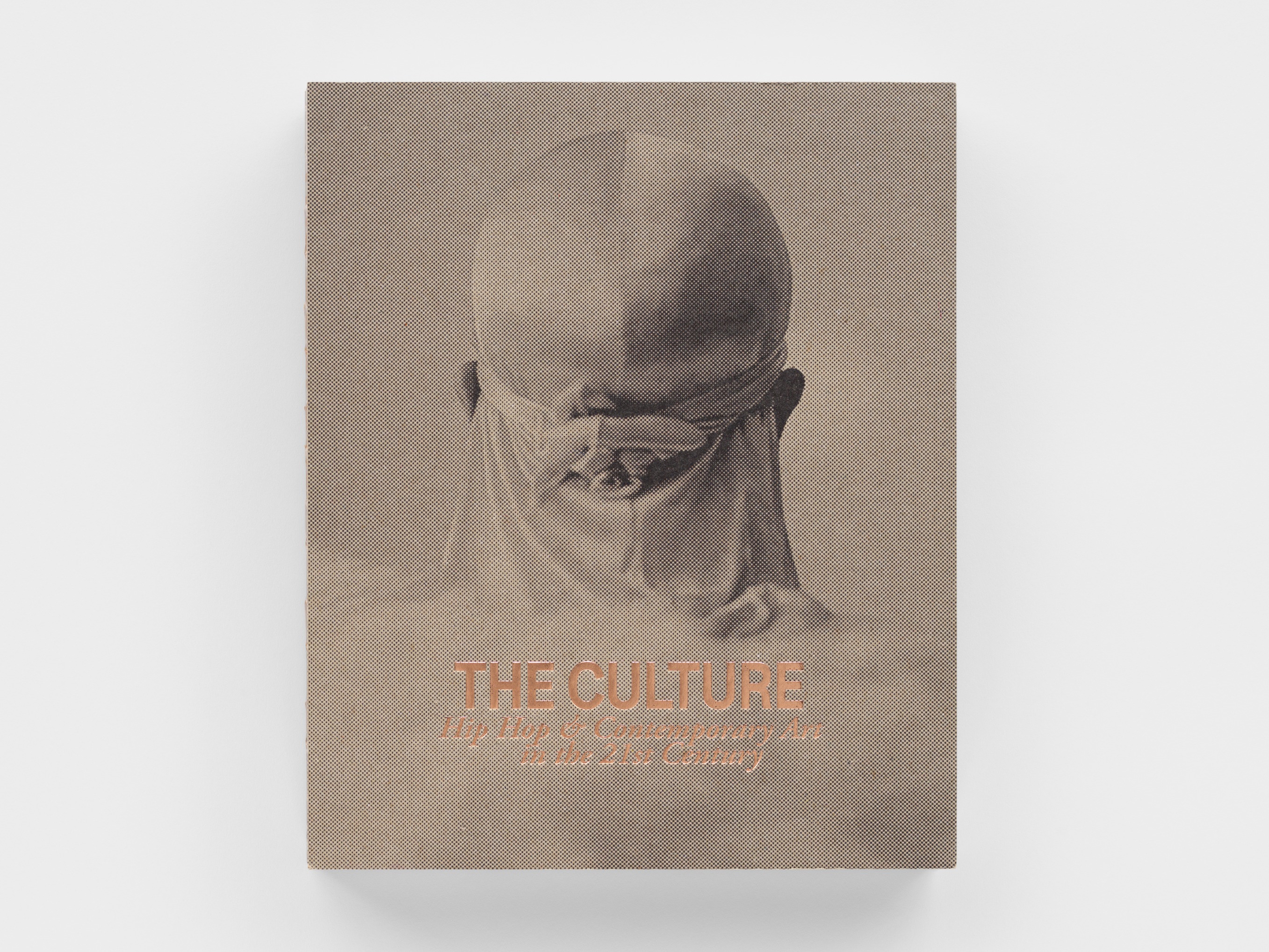 Book cover with a pencil etching and copper embossed title.