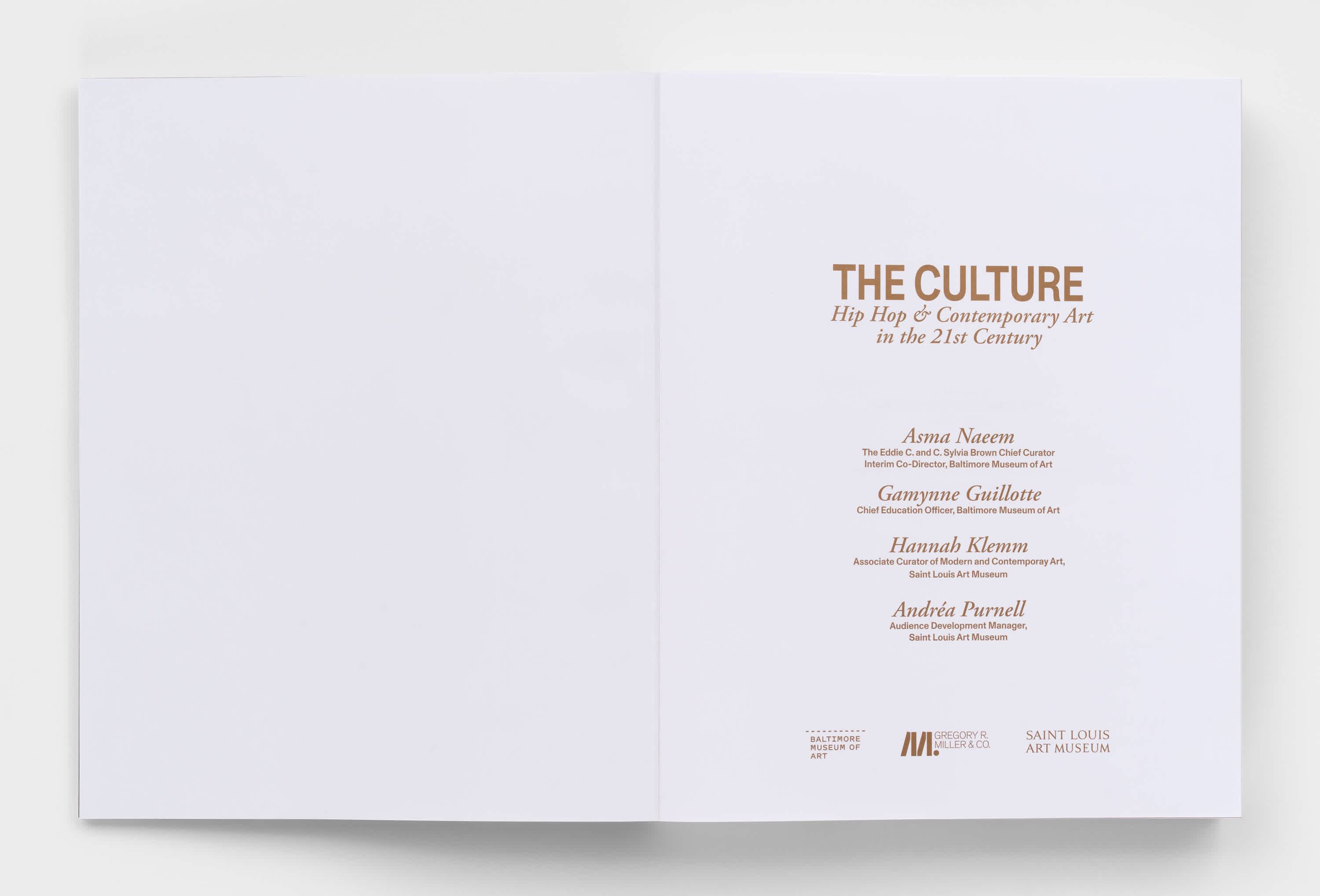 Open book with blank left page and copper text title page.