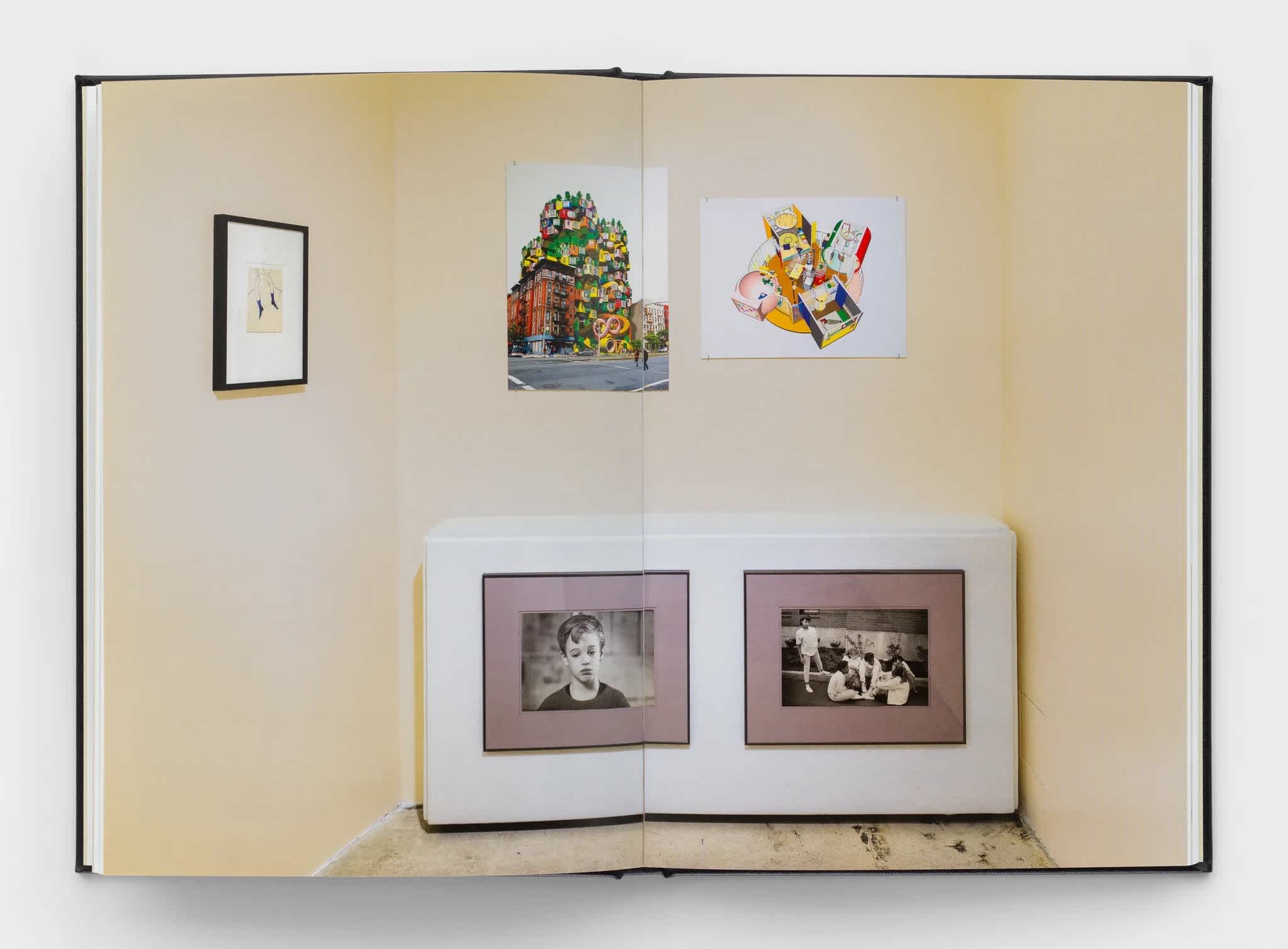 Open book with a centerfold exhibition image.