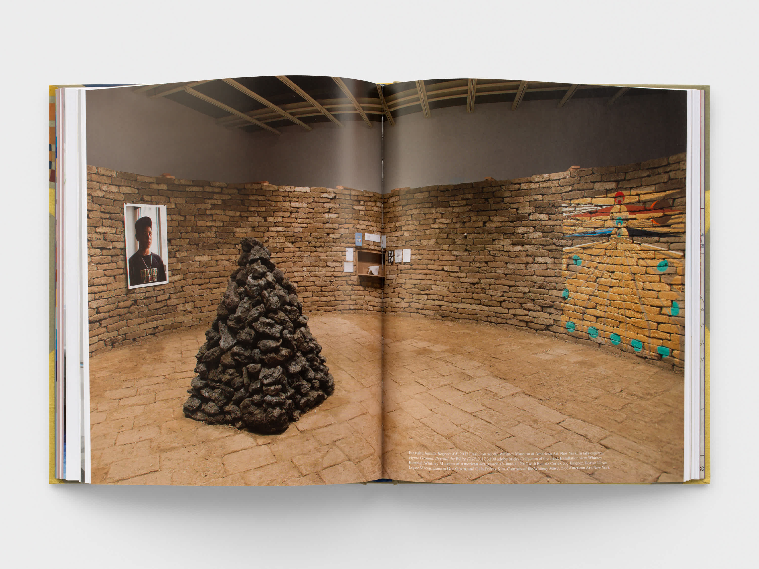 Open book with installation shot on both pages.