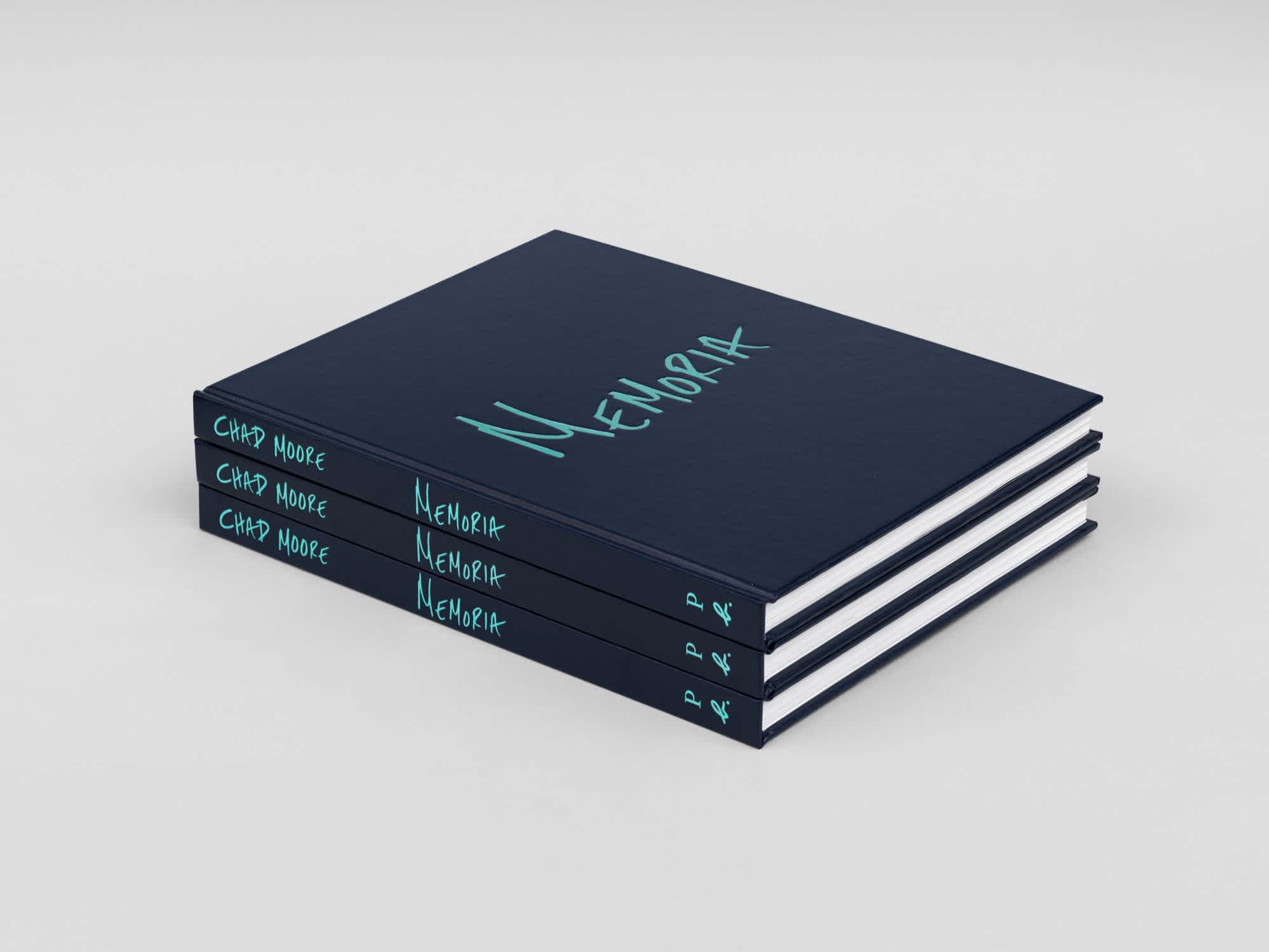 Three navy blue books with light blue text on the cover and spine, aligned on top of each other.