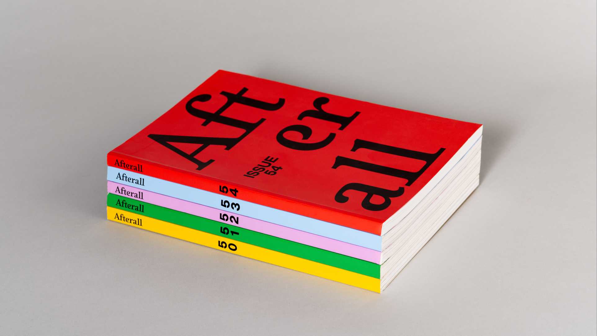 Stack of alternating magazine covers, all with the title "Afterall". The covers are red, yellow, green, purple,  blue.