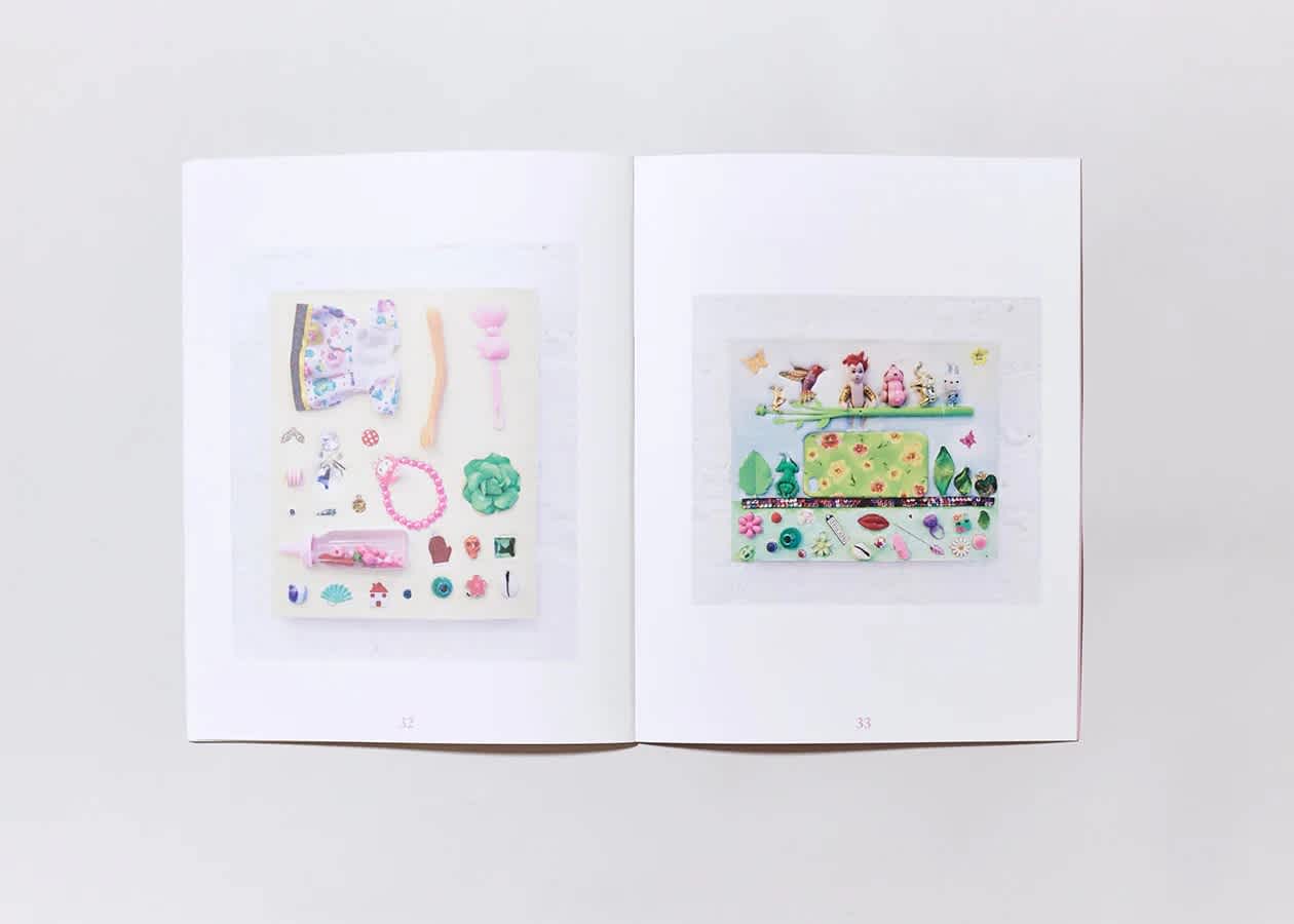 Open book with a different artwork on each page. Both artworks are light pinks, greens, blues, and yellows.