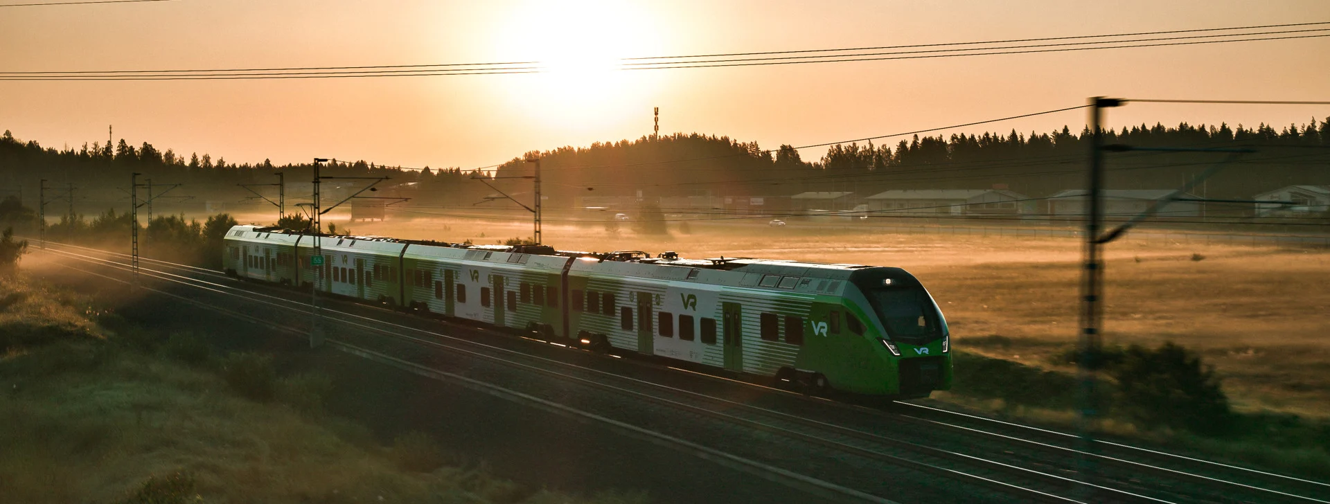 The newest commuter train in a summer setting