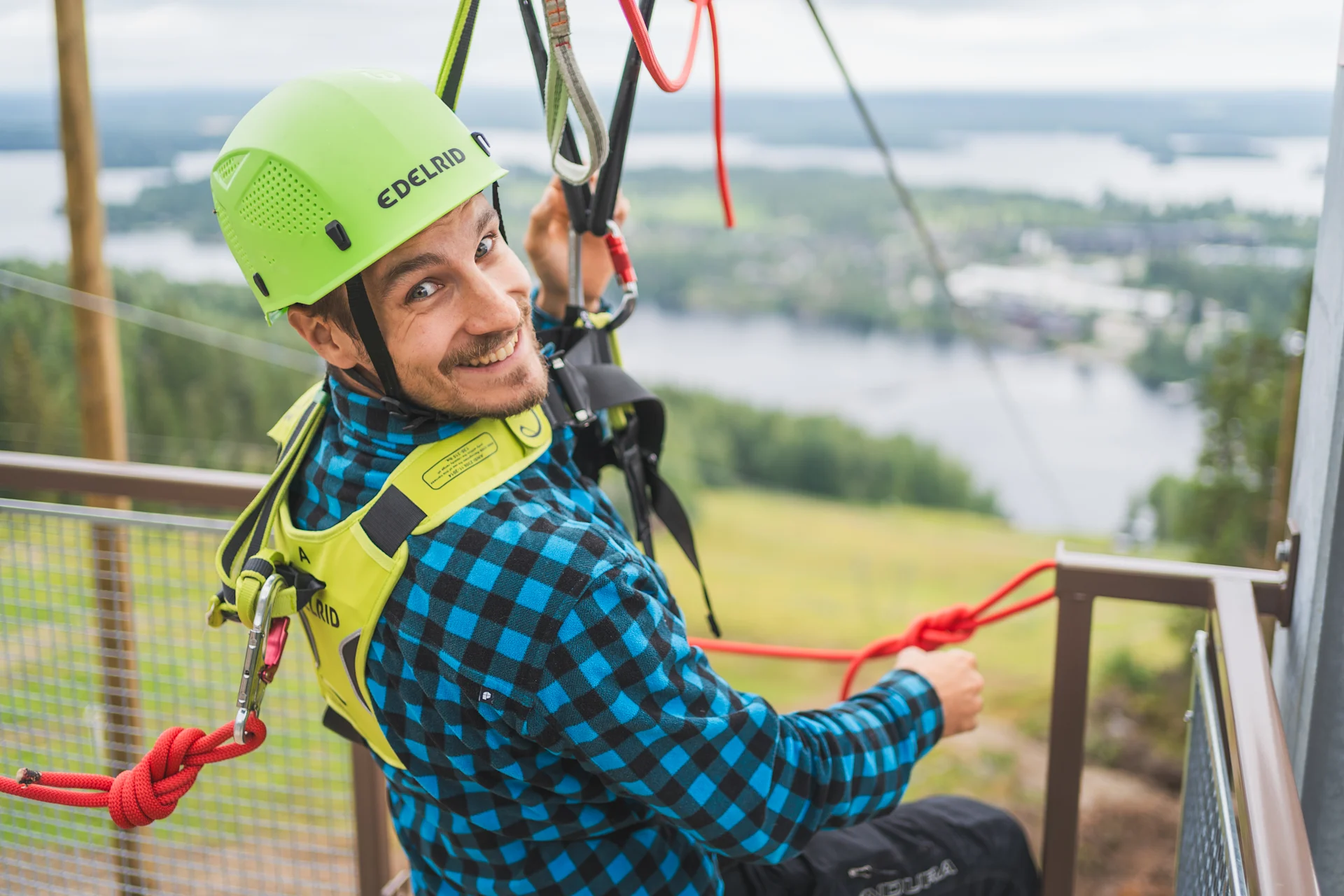 A man about to go down on a zipline