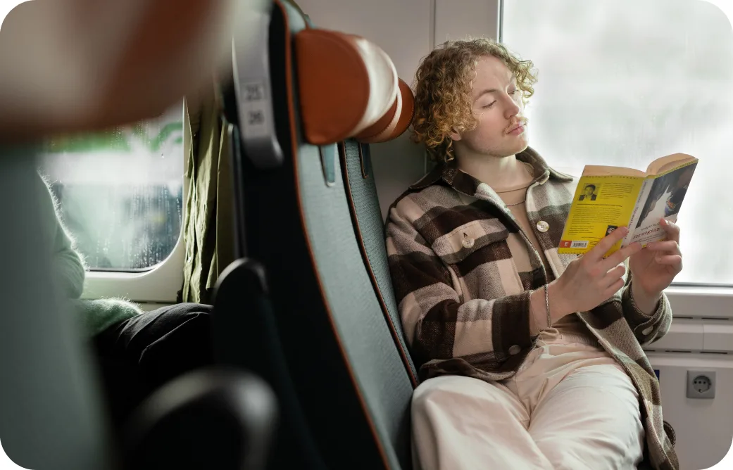 A man reading on the train