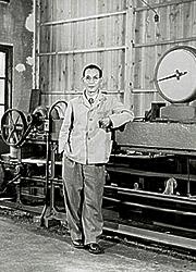 Dr. Kazuma Tateisii withautomated electronic calculatingequipment